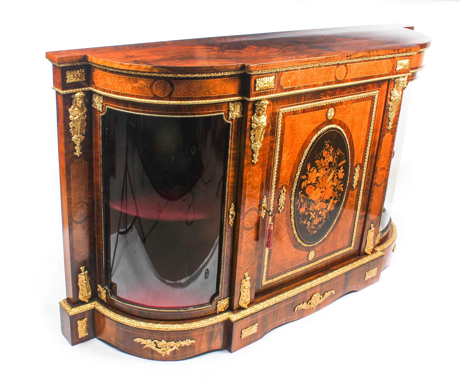 This is a superb antique Victorian burr walnut, amboyna and marquetry inlaid credenza, circa 1850 in date.

Oozing sophistication and charm, this credenza is the absolute epitome of Victorian High Society. Its attention to detail and lavish