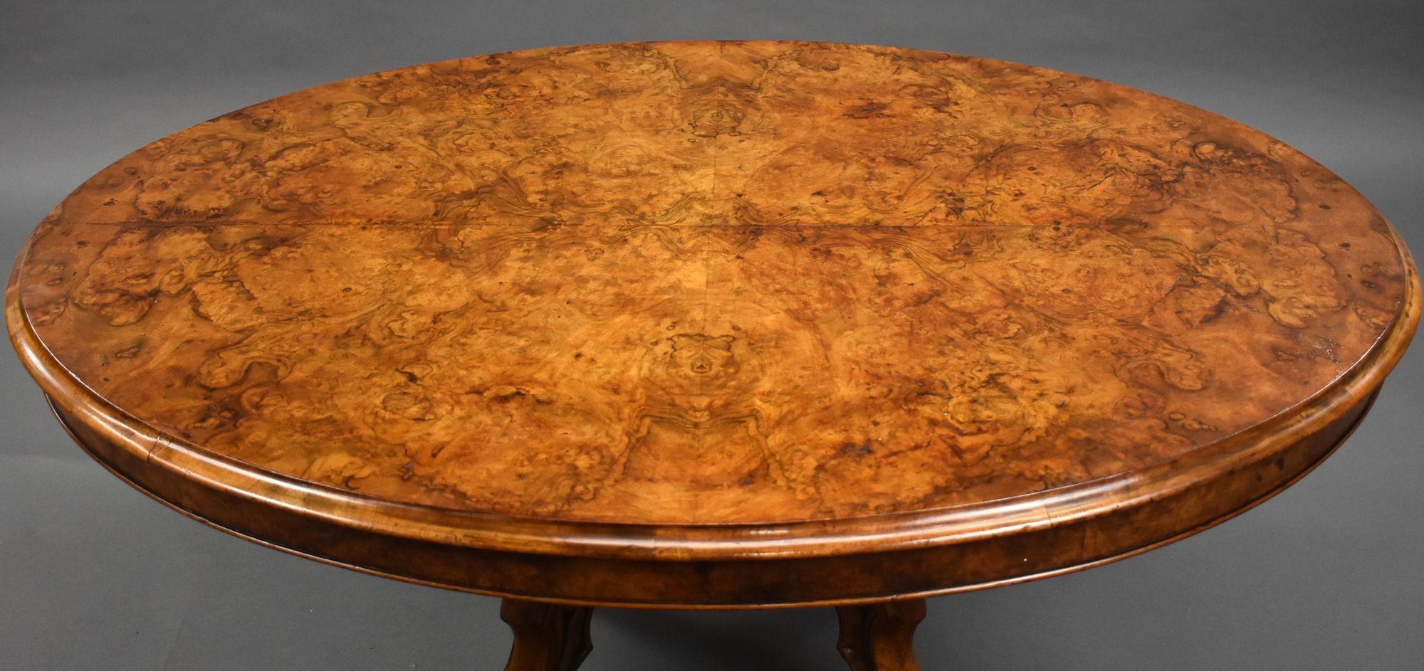 For sale is a good quality Victorian burr walnut oval coffee table, standing on an ornately carved base with scroll feet, the table is in good condition for its age, having a few very small blisters to the the top though we do not feel that this is