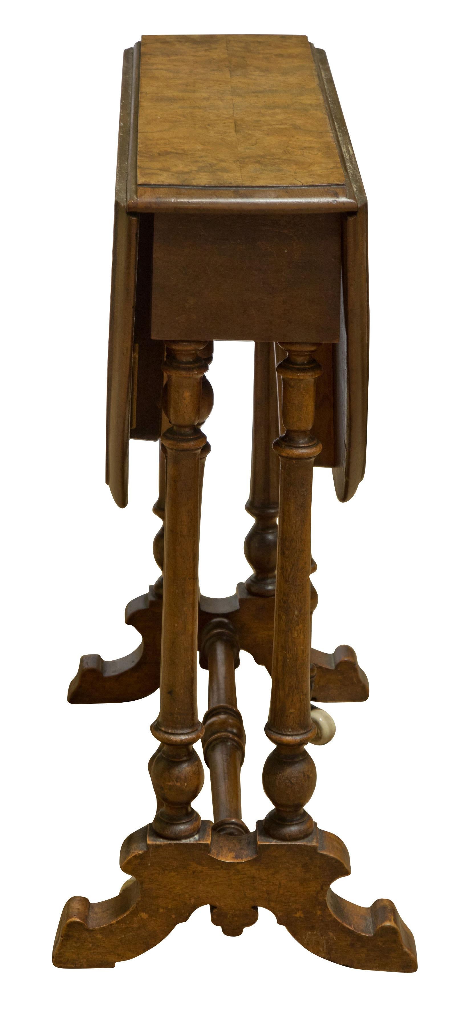 Victorian Burr-Walnut sutherland table of small proportions,


circa 1880