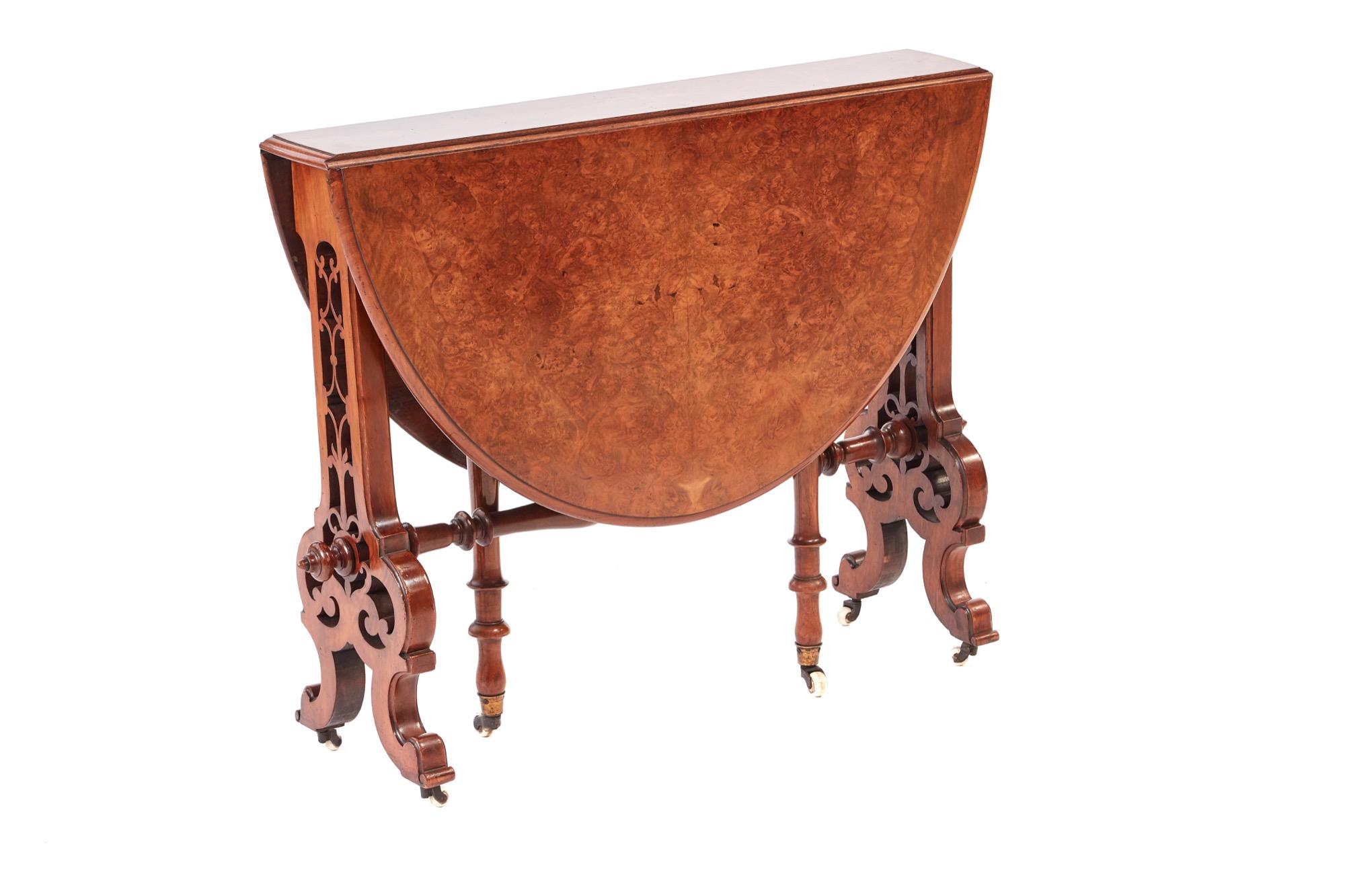 Fine quality Victorian antique burr walnut Sutherland table which has a fantastic burr walnut top with two drop leaves and a swing out turned gate leg. This attractive piece is supported by fantastic carved ends raised by lovely shaped carved