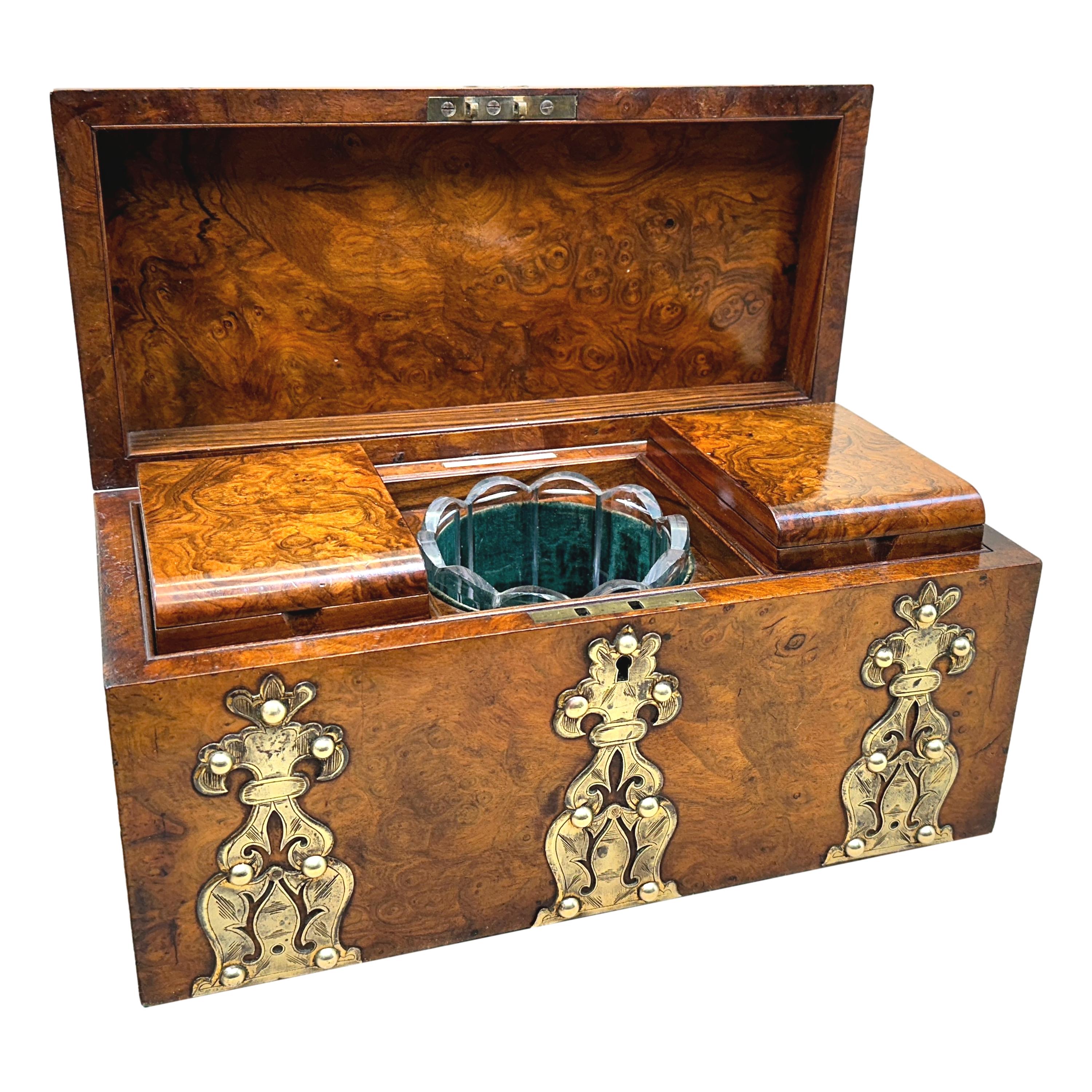 A Superb Quality Mid 19th Century Burr Walnut Tea Caddy Having Original Brass Mounted Decoration And Domed Lid Enclosing Two Removable Lidded Compartments And Glass Mixing Bowl.

Makers Stamp - 