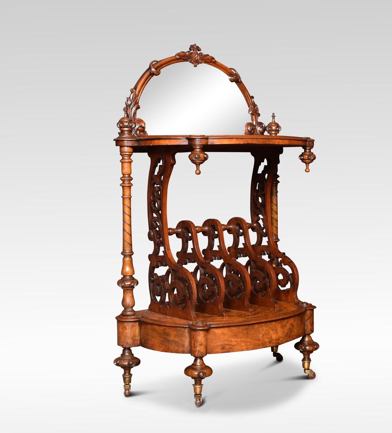 A Victorian burr walnut veneered what-not the mirror back within ornate foliate pierced frame. To the top of bowed outline with pendant drops above a four compartment front joined by turned spindles. Flanked by spirally fluted pillars, on shaped