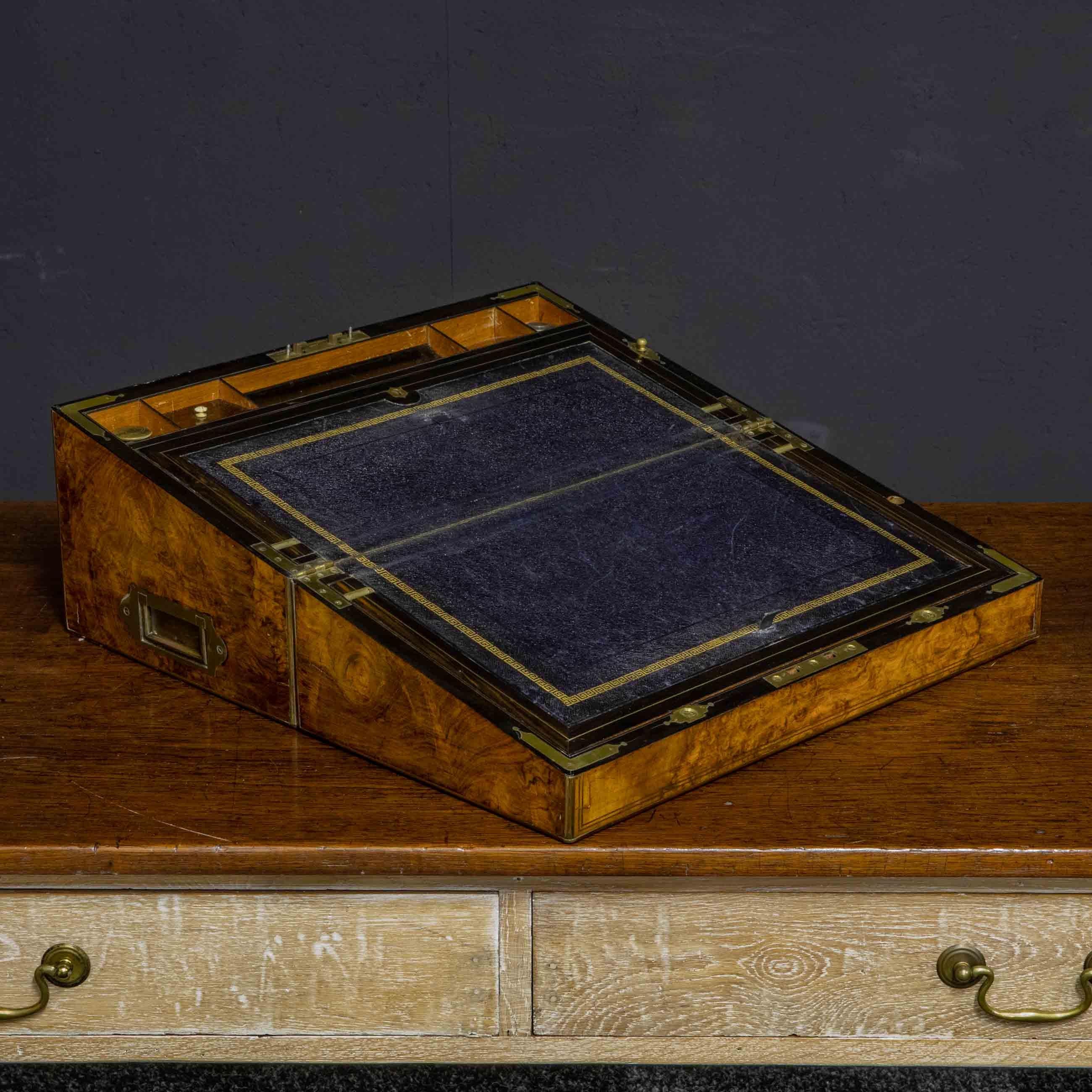 A superb Victorian burr walnut veneered travelling writing box from the mid-19th century. Absolutely original and with little sign of use this piece is in excellent condition. Everything about the writing companion is of more exceptional quality.