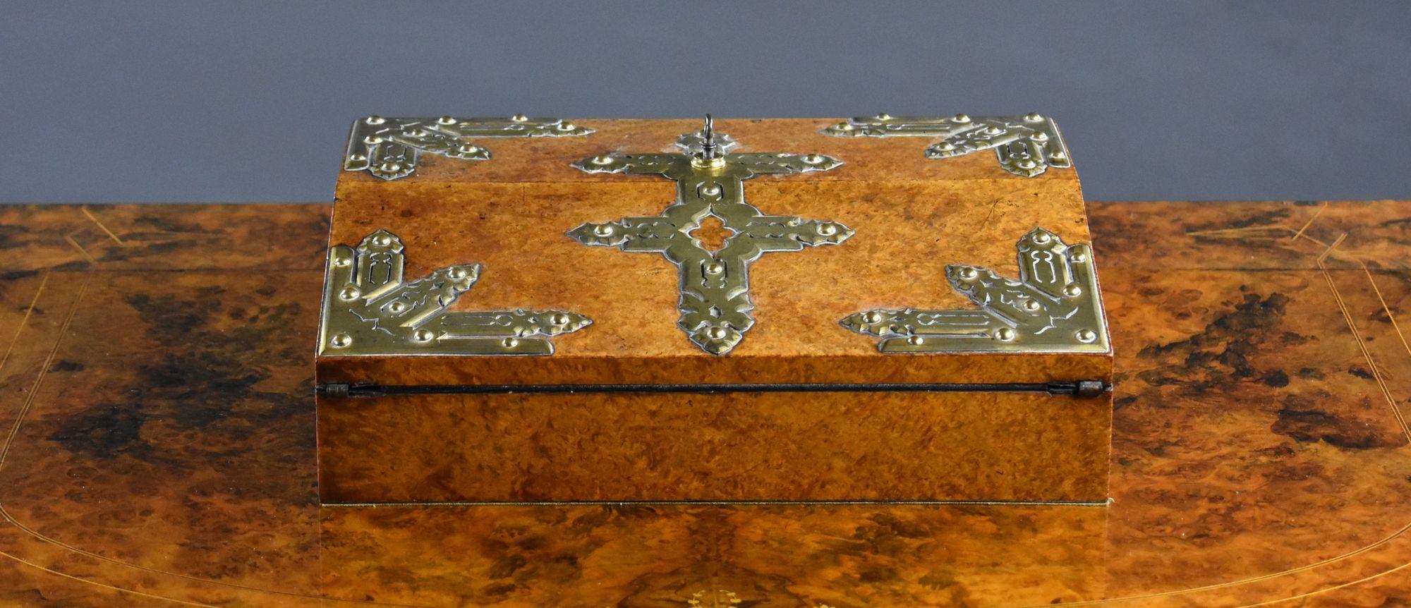 Victorian Burr Walnut Writing Slope with Brass Mounts
Item Code: LC1115
Circa 1870
A highly decorative Victorian burr walnut writing slope of compact proportions, adorned with pierced and engraved brass mounts in a Gothic Revival style. The richly