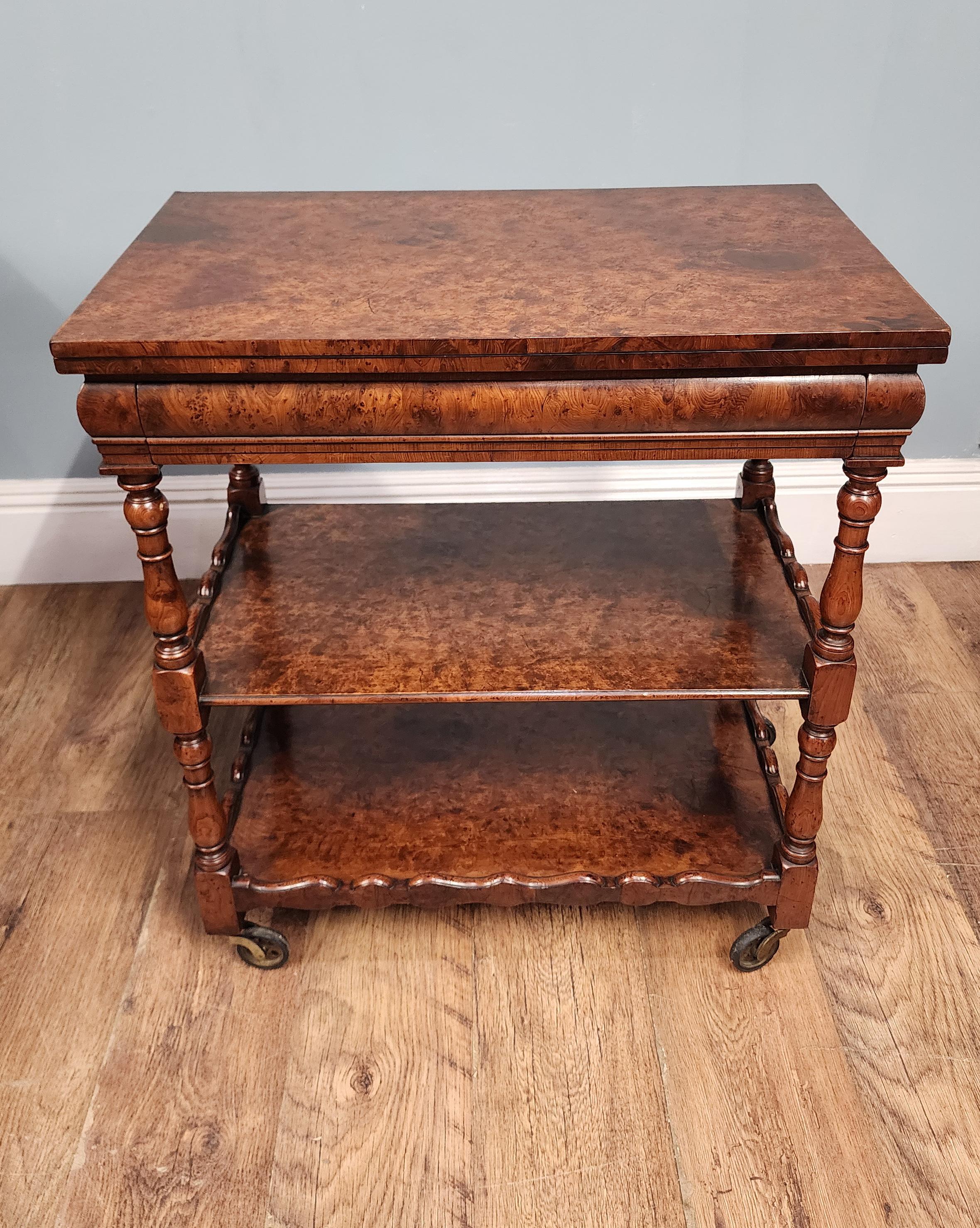 A handsome Victorian three-tier whatnot crafted in richly figured burr walnut, displaying the warm colour and swirling grain typical of mid-19th-century English cabinetmaking
Circa 1890
The top surface has a clean rectangular form with rounded