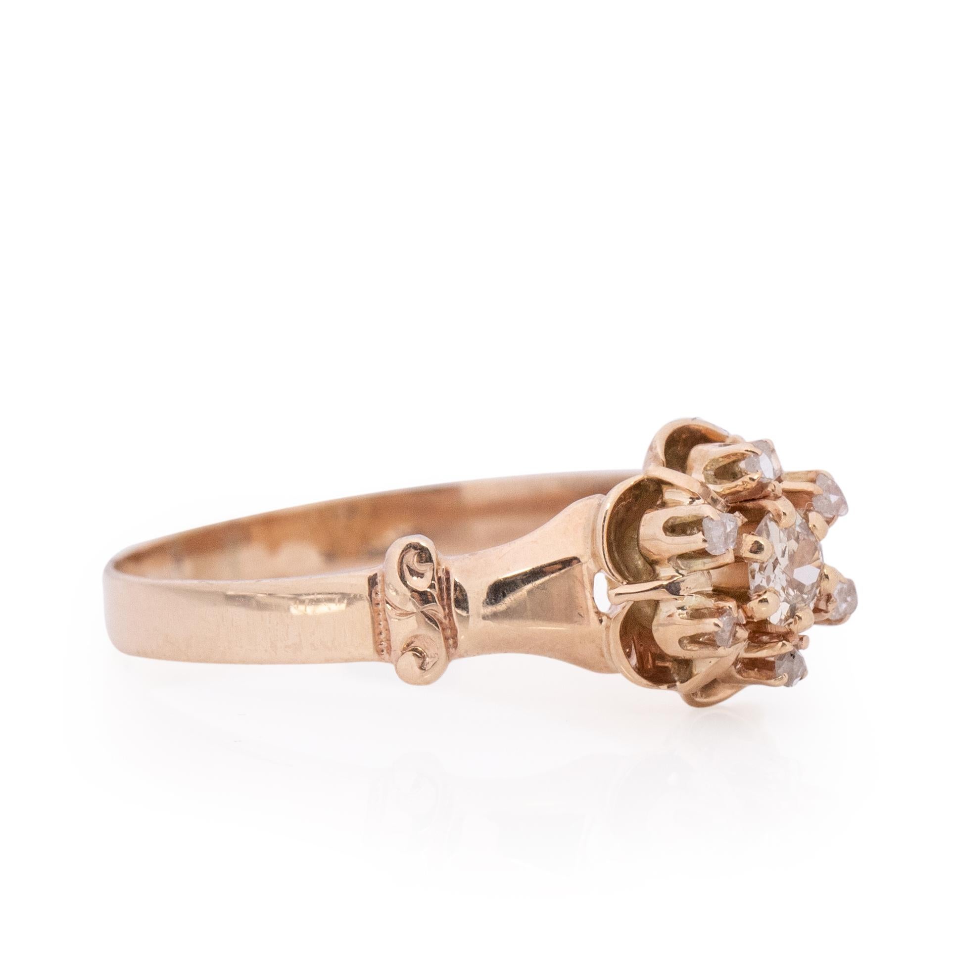 This ring is a true work of art, unique and elegant. This belcher inspired buttercup style ring is reminiscent of  the spring time. Crafted in 
yellow gold, the center diamond is held in the center of the belcher design and surrounded in a six