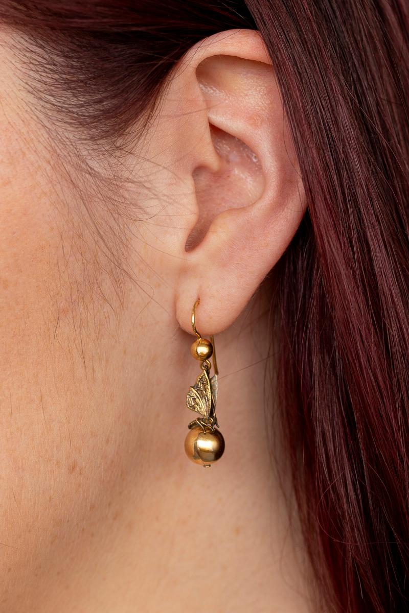 Victorian 15 kt gold full round butterflies alight on your ear with diaphanous wings in resting position. They are as light as a butterfly itself weighing 1.7 grams each. The earrings created in c.1870 look as if they were made today. The condition