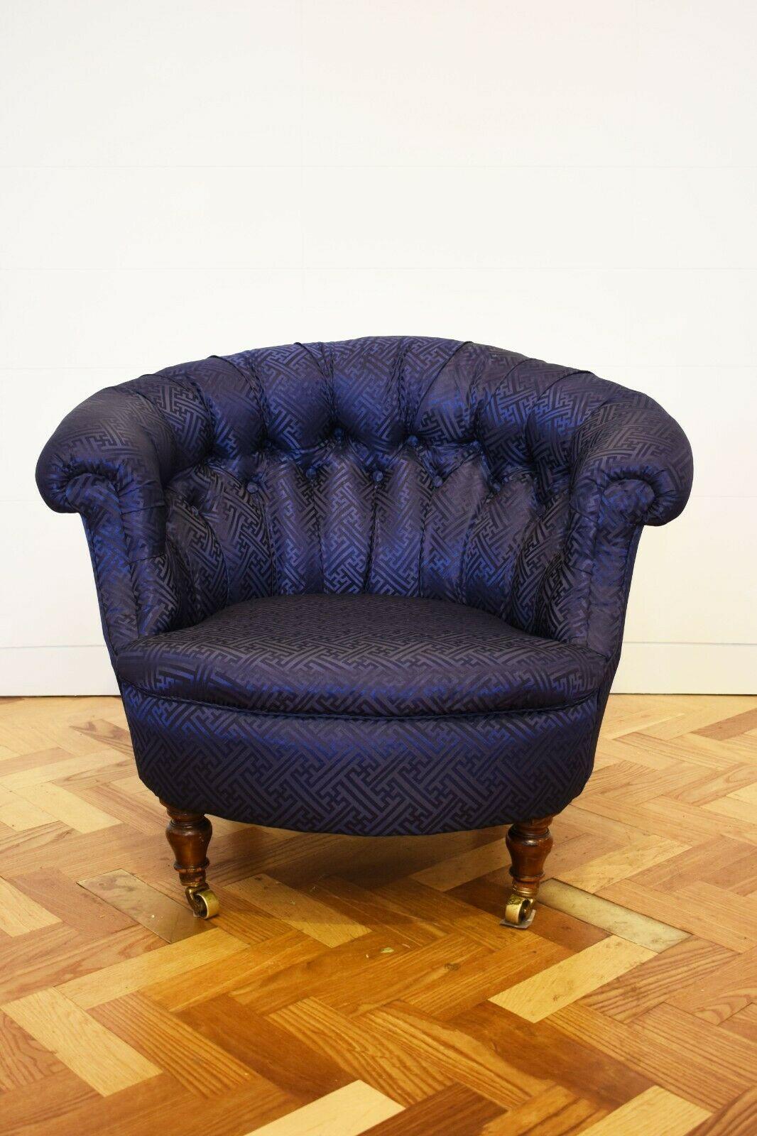 Victorian Button Back Tub chair with Mahogony Legs, Upholstered in Navy Silk

Set upon mahogony legs with brass castors, this classic Victorian tub chair design has been reimagined through its newly upholstered geometric fabric. 

This chair