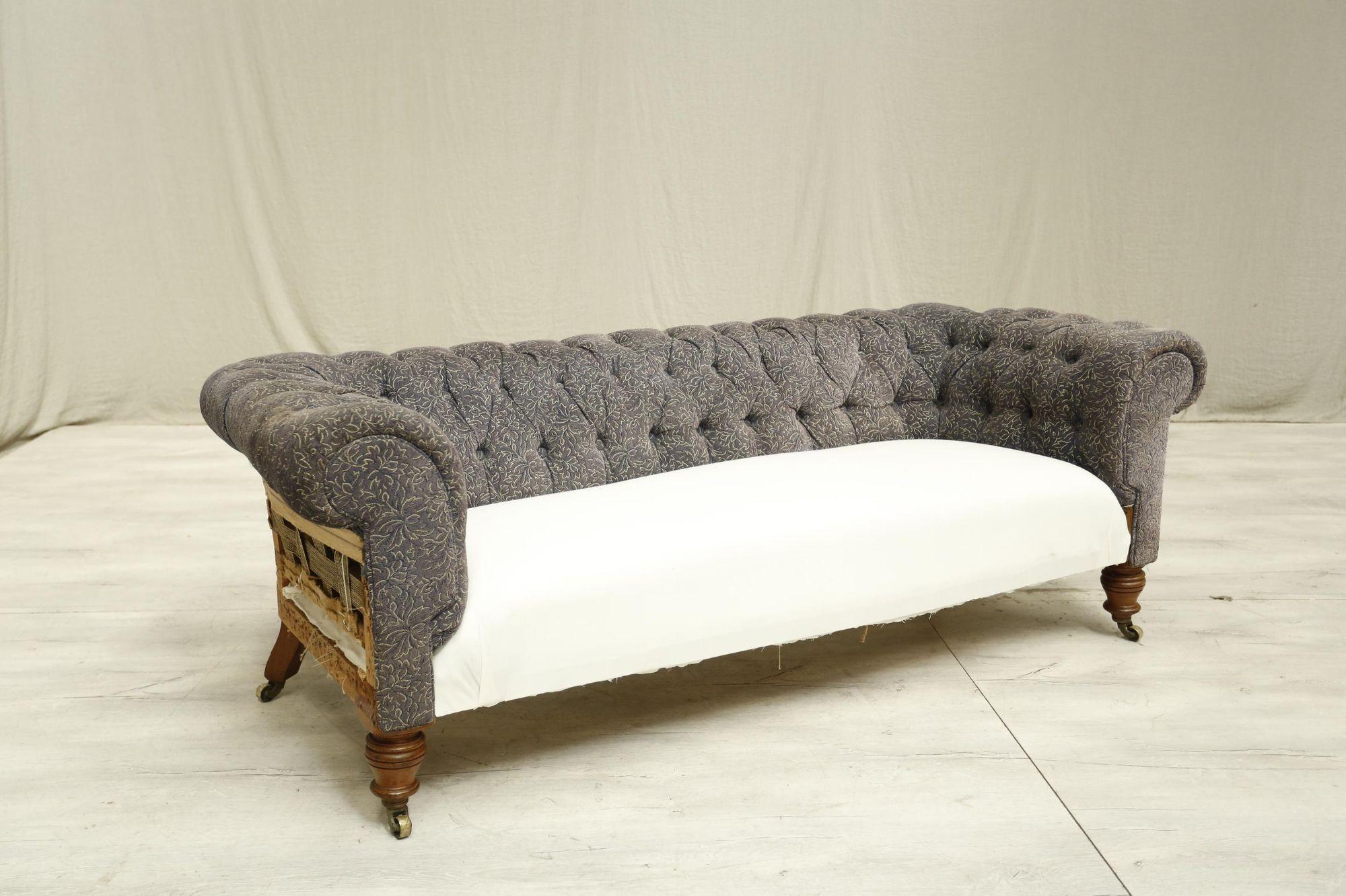 This is a superb quality 19th century English chesterfield sofa. It is a great size and very comfy. It has a fabulous buttoned back which will look very inviting when upholstered. The front legs are turned oak and capped with casters. The shape of