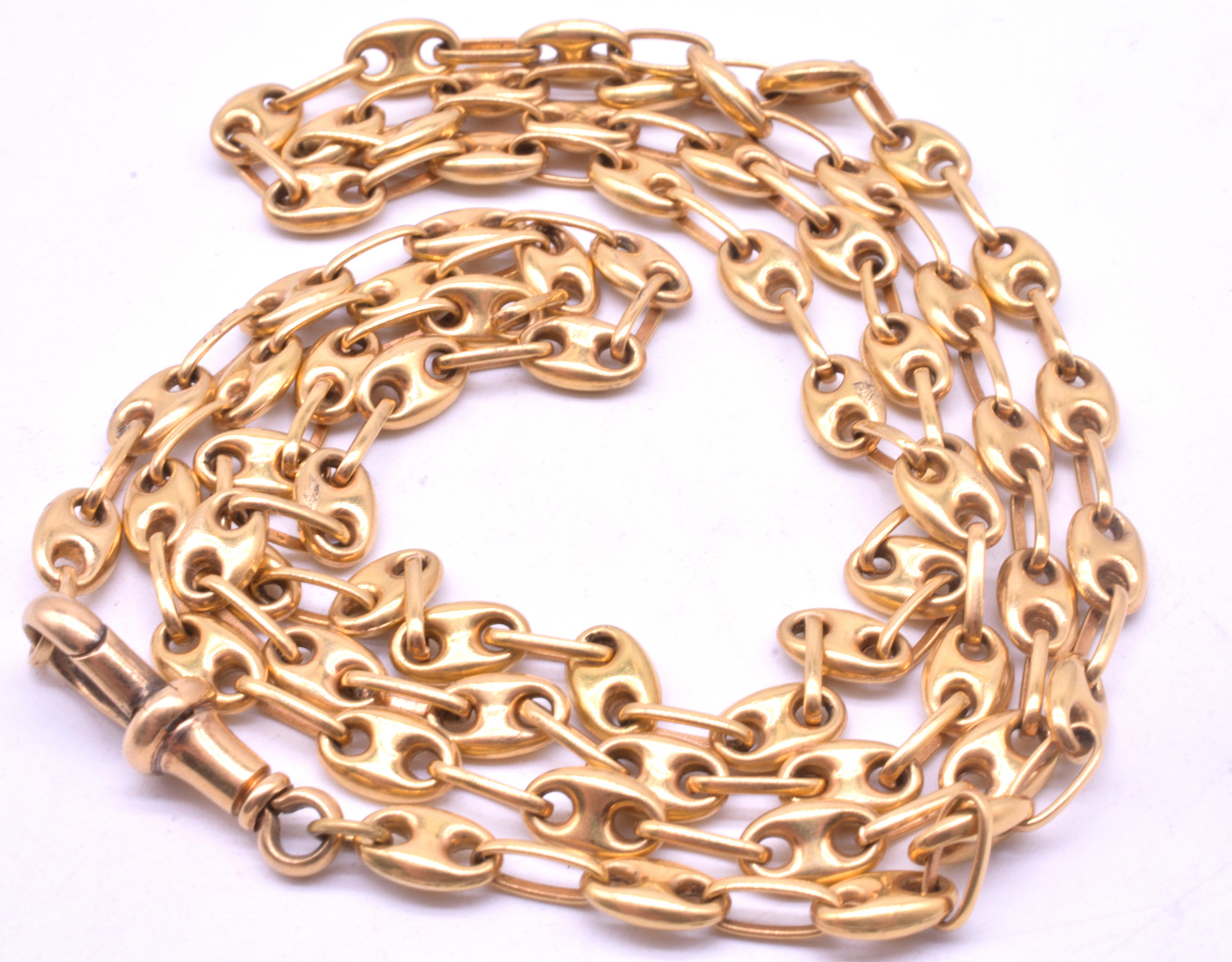 A classic Victorian 18K anchor link chain with delicate anchor links and an integral dog clip from which one can hang an optional pendant. This anchor link chain with its nautical motif is a symbol of strength and outdoor sporting.   The name of