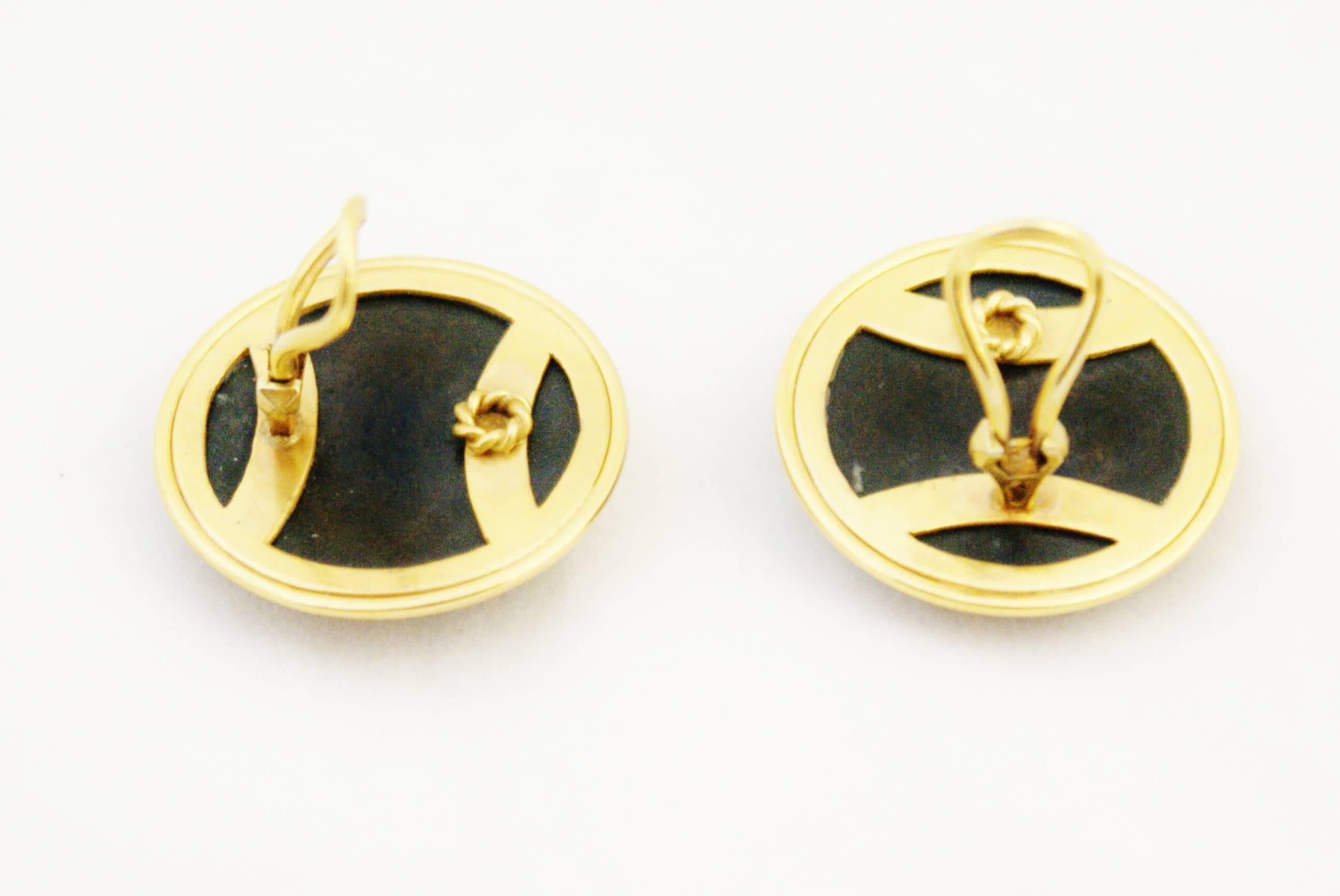 A very fine and unusual pair of Shakudo earclips circa 1880. The domed plaques are bronze inlaid with gold. They are mounted on silver gilt.
 As a result of the opening up of Japan to trade with Britain in the 1850s, an English craze for all things