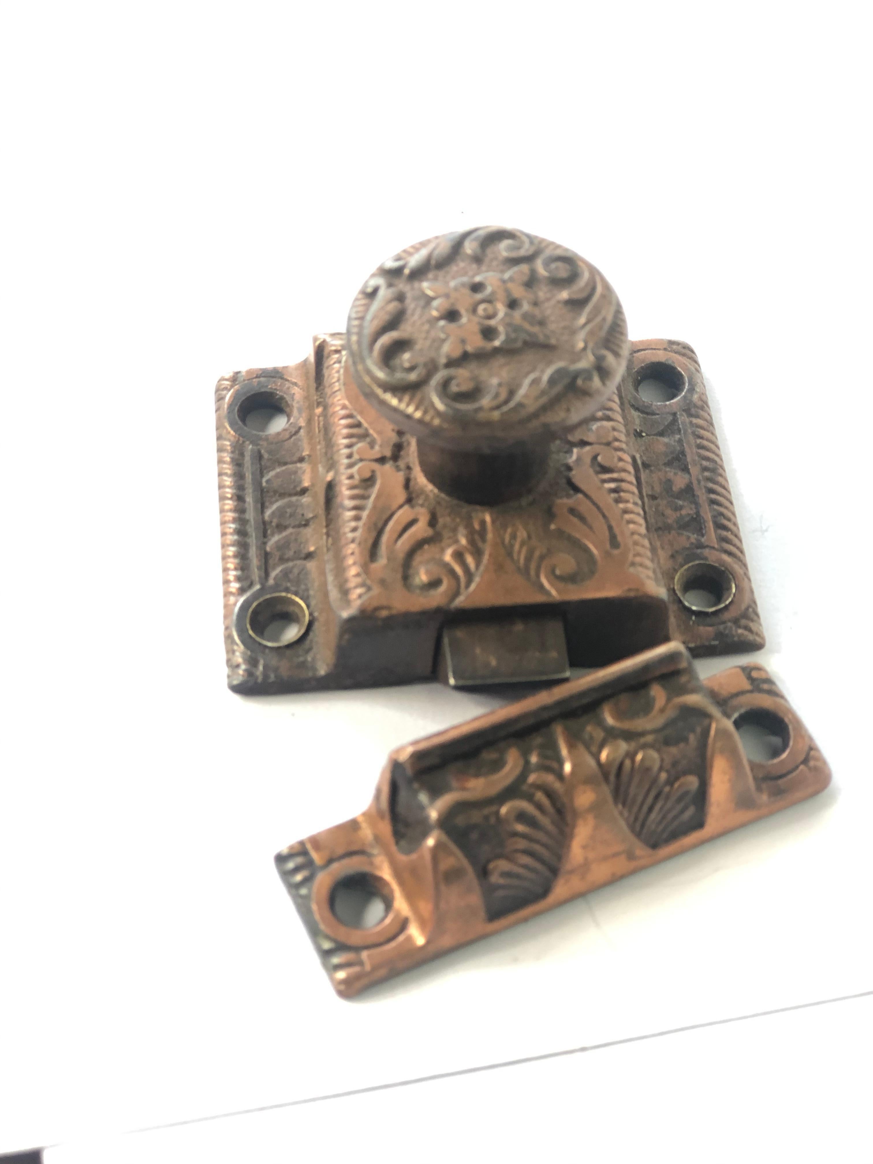 Beautifully detailed latch with a soft copper blush patina.
 