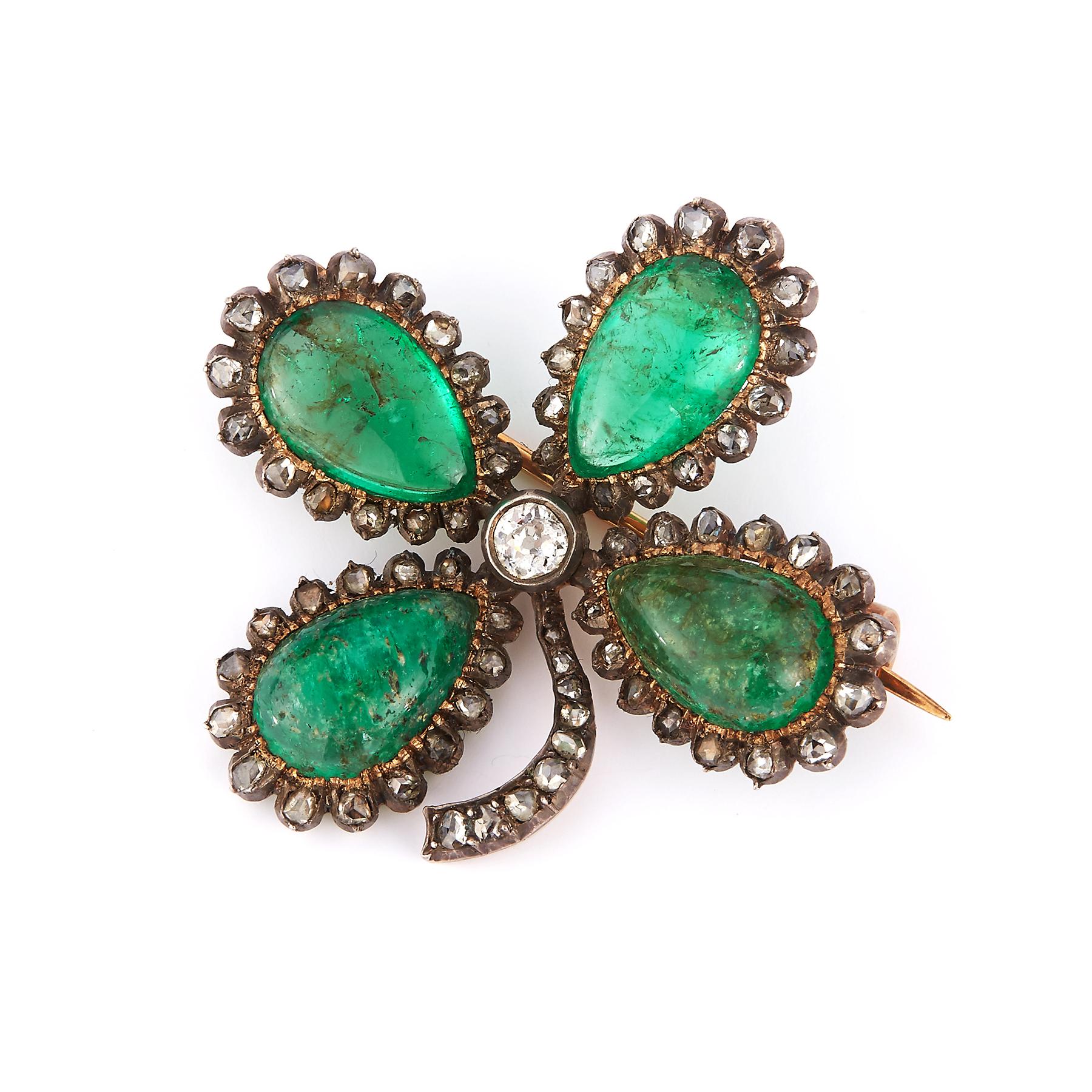 Victorian Cabochon Emerald Four Leaf Clover Brooch

Includes 4 cabochon emeralds surrounded by an array of diamonds 

Antique

Measurements: Approximately 1.50 x 1.50 Inches
