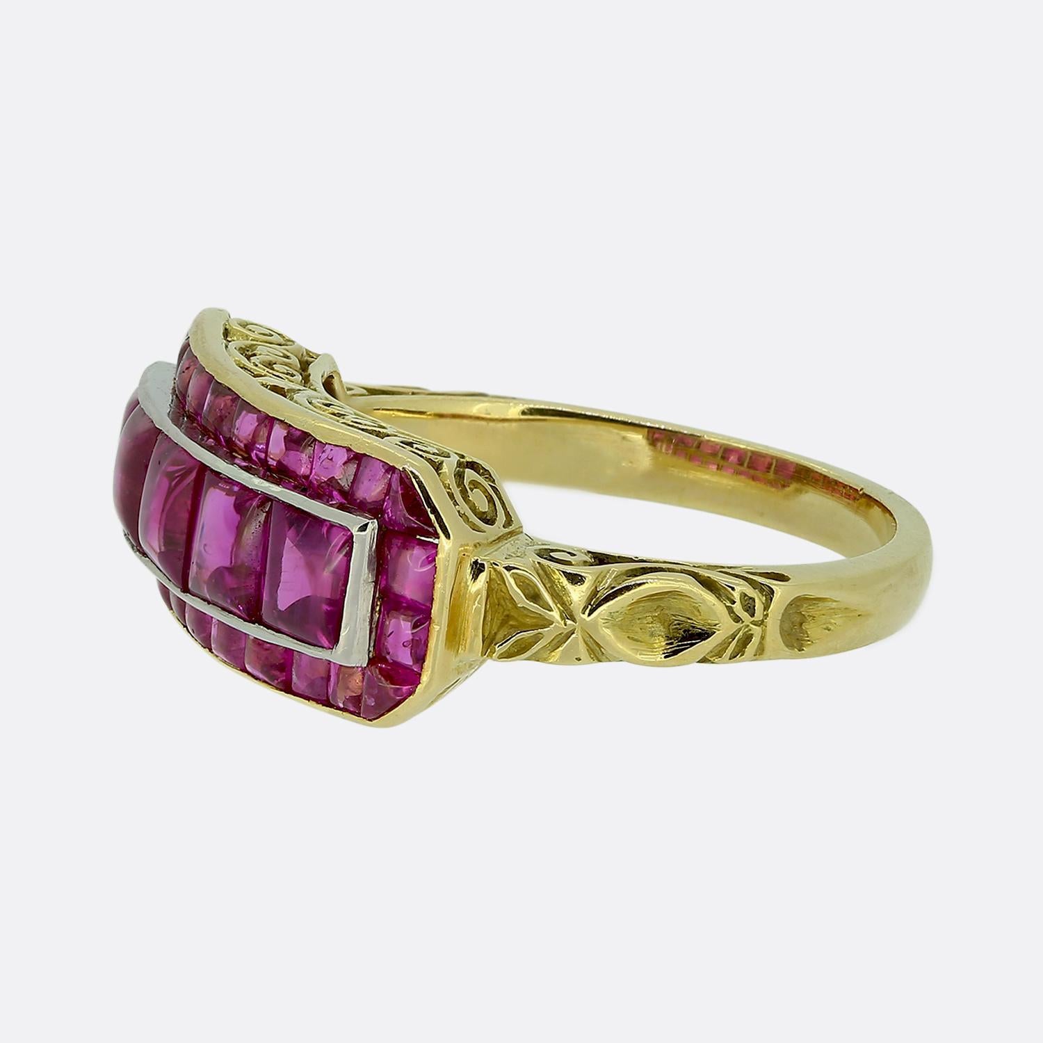 Here we have a wonderfully unique ring taken from the Victorian period. This antique piece showcases a captivating array of square cabochon-cut rubies, each exuding a gorgeous pinky red colour tone. Each stone has been meticulously arranged to form