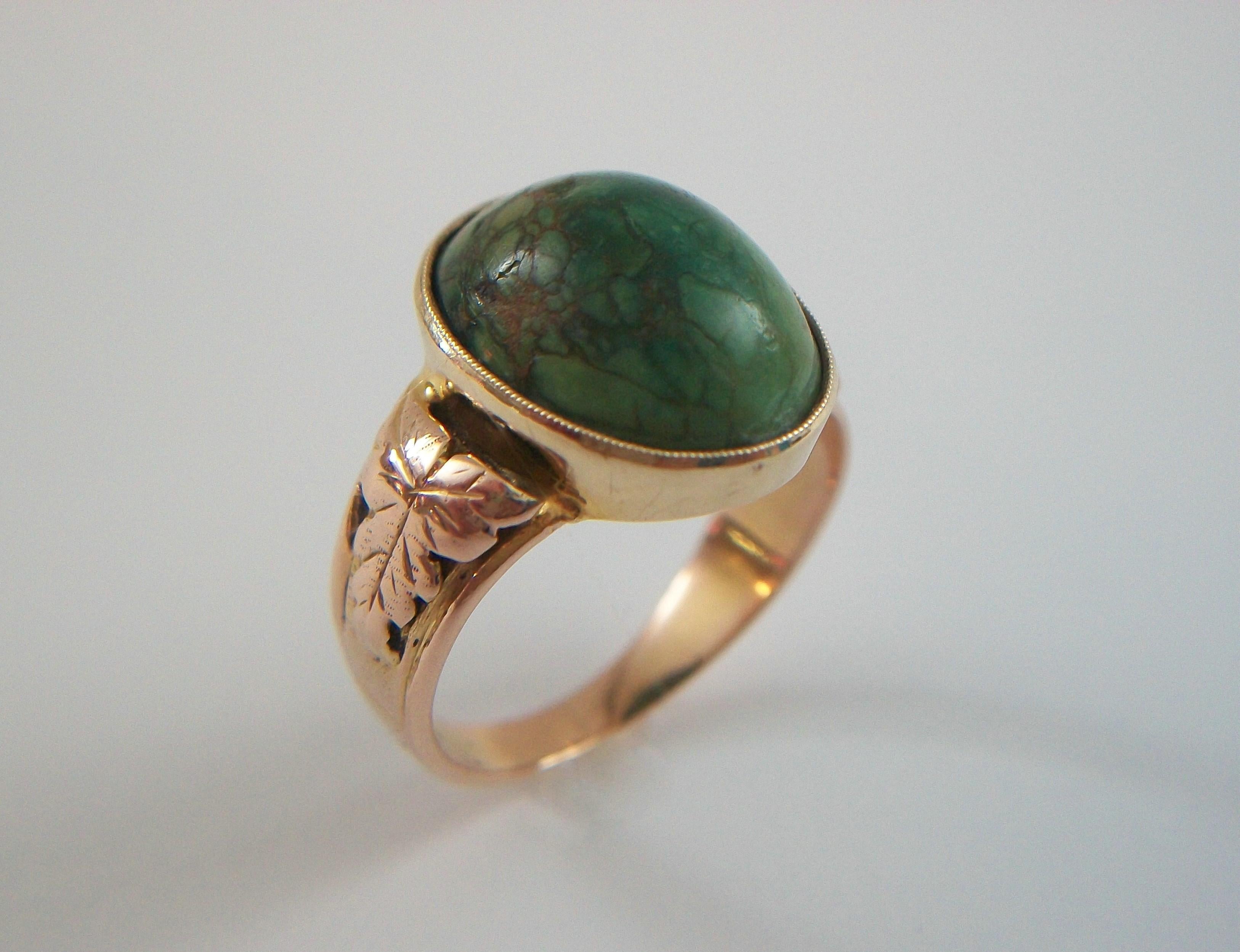 Victorian Turquoise and 18K yellow gold cocktail ring - hand made - featuring a milgrain set natural oval cabochon Turquoise (approx. 8.73 carats - 14 x 11 x 7.5 mm.) - the shoulders with applied acanthus leaf details - open setting from the back -