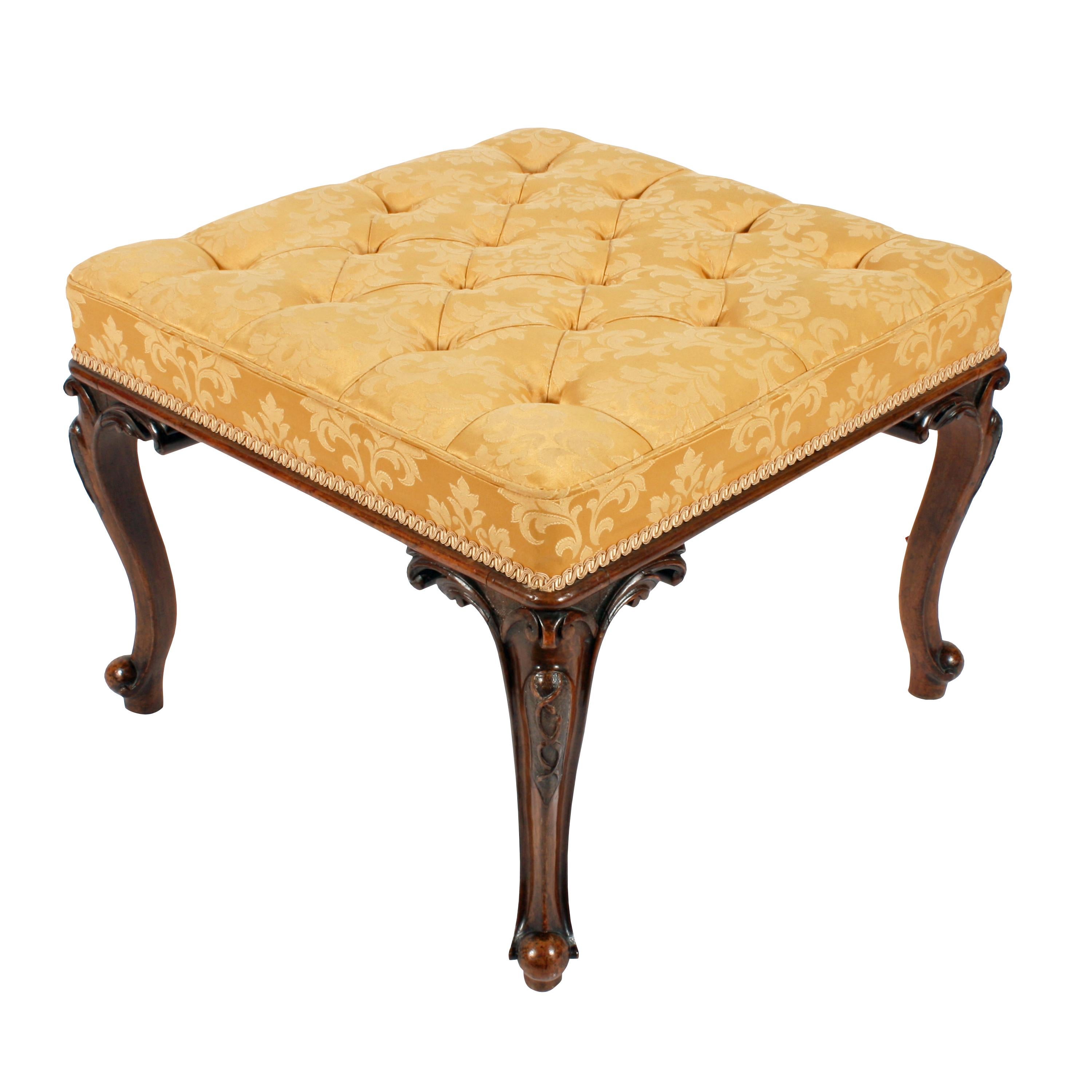 A fine quality mid-19th century Victorian square carved walnut stool.

The stool has four cabriole legs with scrolled toes and carved knees.

The contemporary button upholstered seat has a piped edge and a braid above the walnut molded