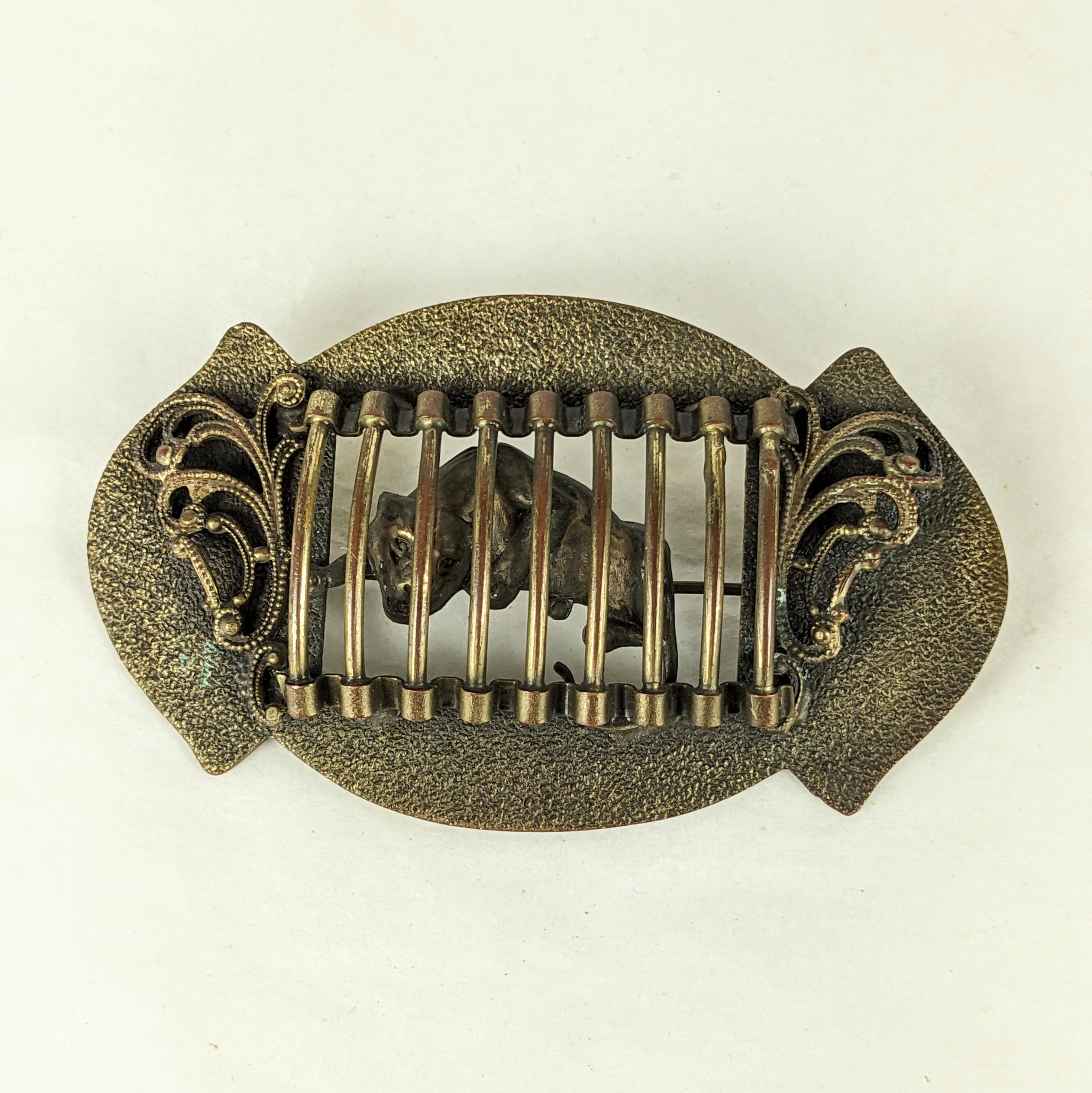 Unusual Victorian Caged Tiger Sash Pin from the late 1800's. Textured antique brass frame with filigree adornments on each side of the 3D cage with tiger set behind. Cool and unusual subject, 1890's USA. 
Large 3.5