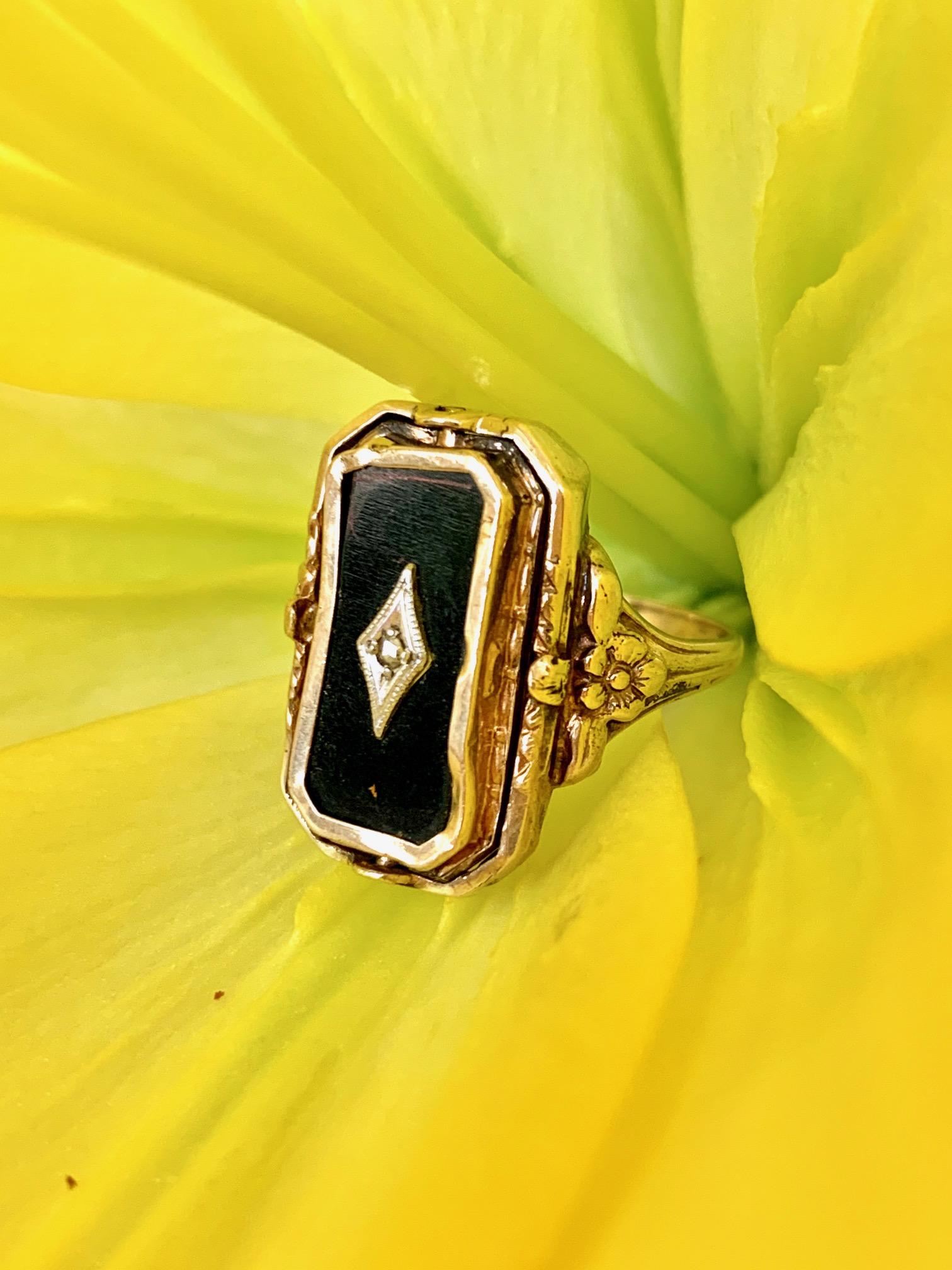 This Victorian ring is reversible, featuring a stone Cameo on one side and black Onyx and Diamond mourning jewelry on the other side of the ring.  The ring setting is 10k yellow gold.
Cameo measures: 
Weight: 4.4 grams
Size: 5 - this ring is