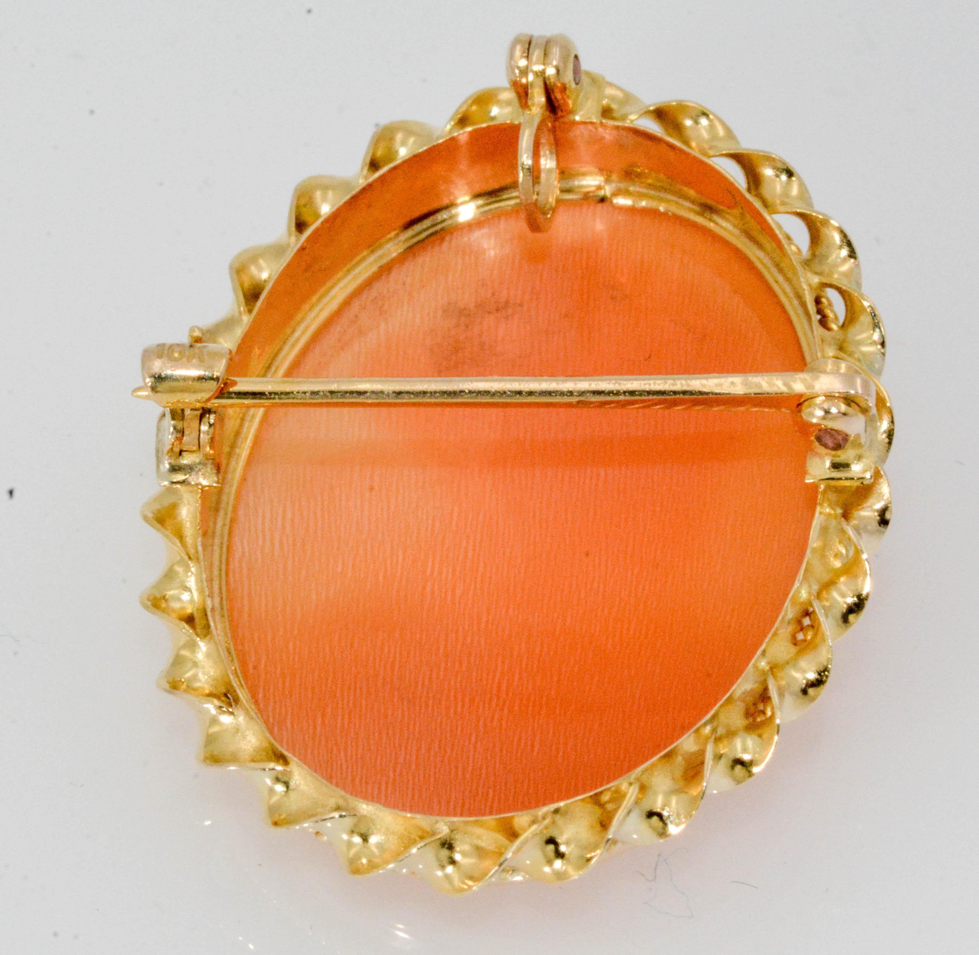 A delightful 1920's Victorian Cameo pendant brooch conversion. 10 karat yellow gold. 3/4 inch wide.
