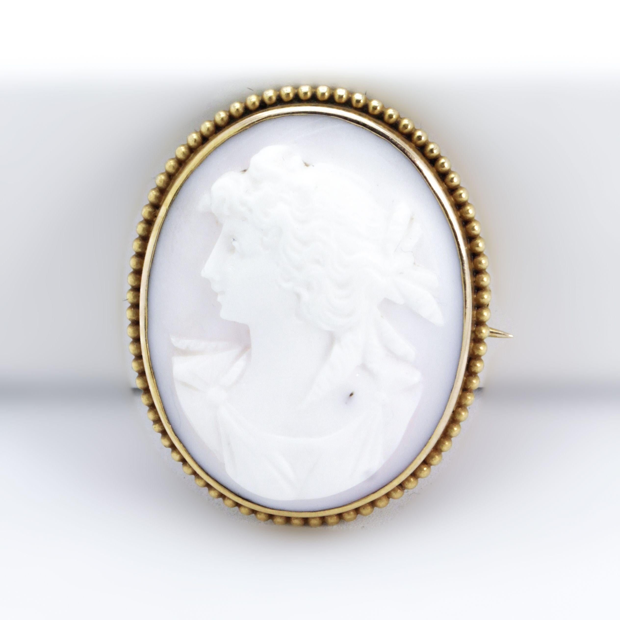 Victorian Shell Coral Cameo brooch /pin with intricate carving into the shell of a Victorian woman with fabulous features and curly locks. Very sweet Brooch in 9 ct yellow to rose gold

Approximate Dimensions:

Width = 2.80cm

Length =