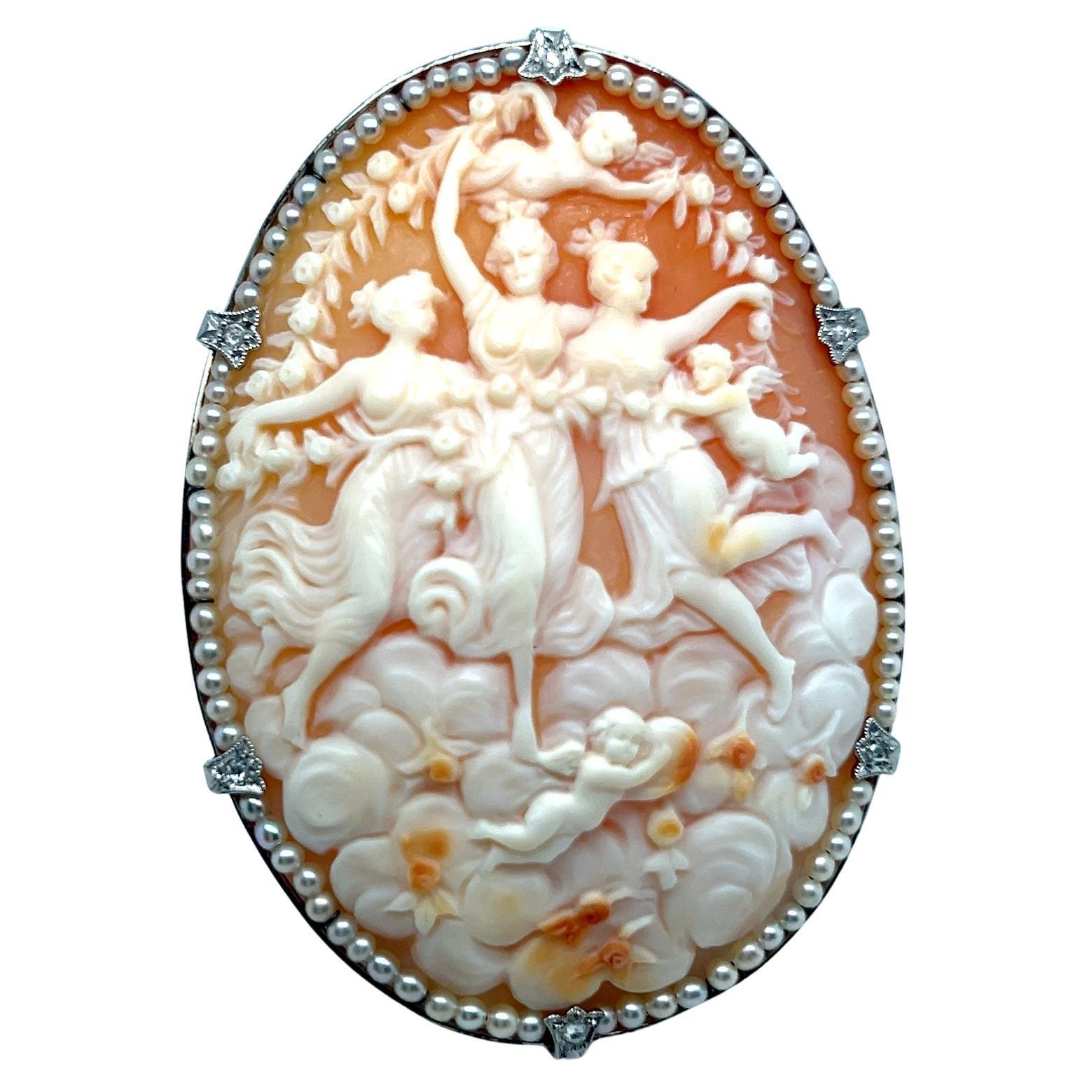 This exquisite 19th-century cameo brooch features the timeless motif of the Three Graces, expertly carved from a single shell. 

Crafted between 1880 and 1890, during Victorian era of elegance and fine artistry, the brooch is set in Platinum. It is