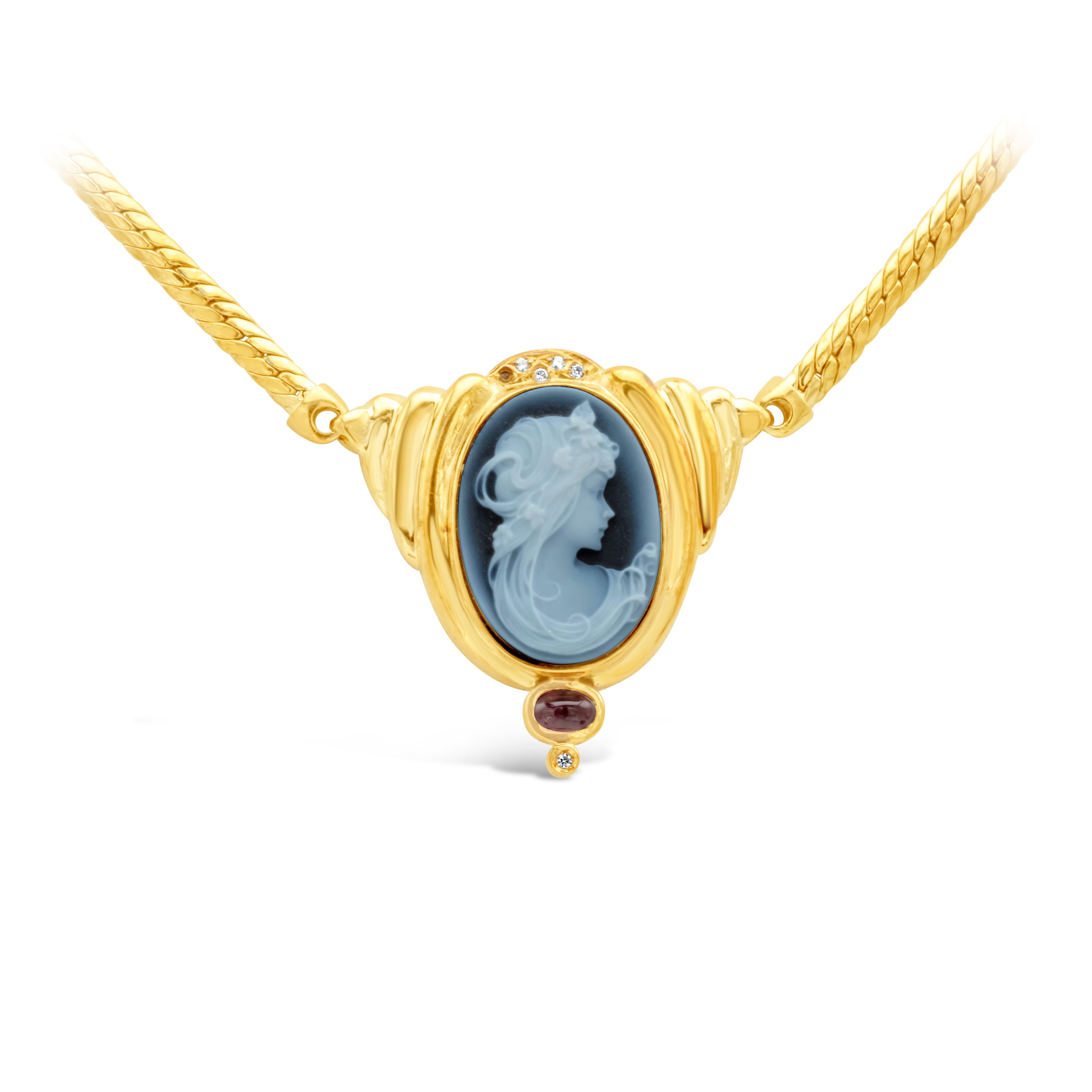 Showcasing a beautiful victorian blue cameo Carving of a woman. Accented with pink sapphire and diamonds. Suspended on a 18k yellow gold chain and perfectly made in 18k yellow gold.