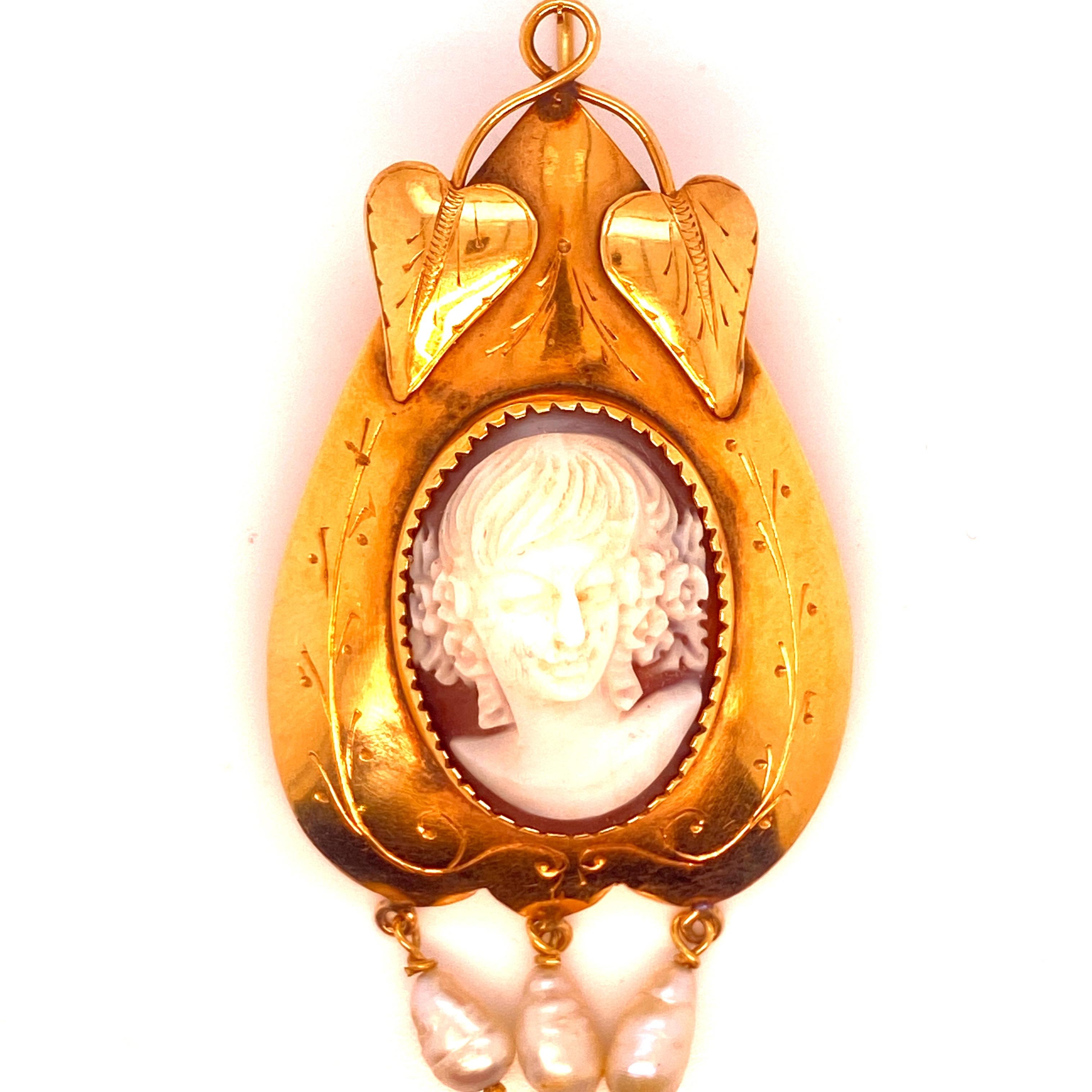 Authentic Victorian 12k gold earrings, comprised of shell cameo figures depicting Classical Female faces , adorned with bead pendants.

CONDITION: Pre-owned - Excellent 
METAL: 12k white Gold 
MEASURES: 2,75