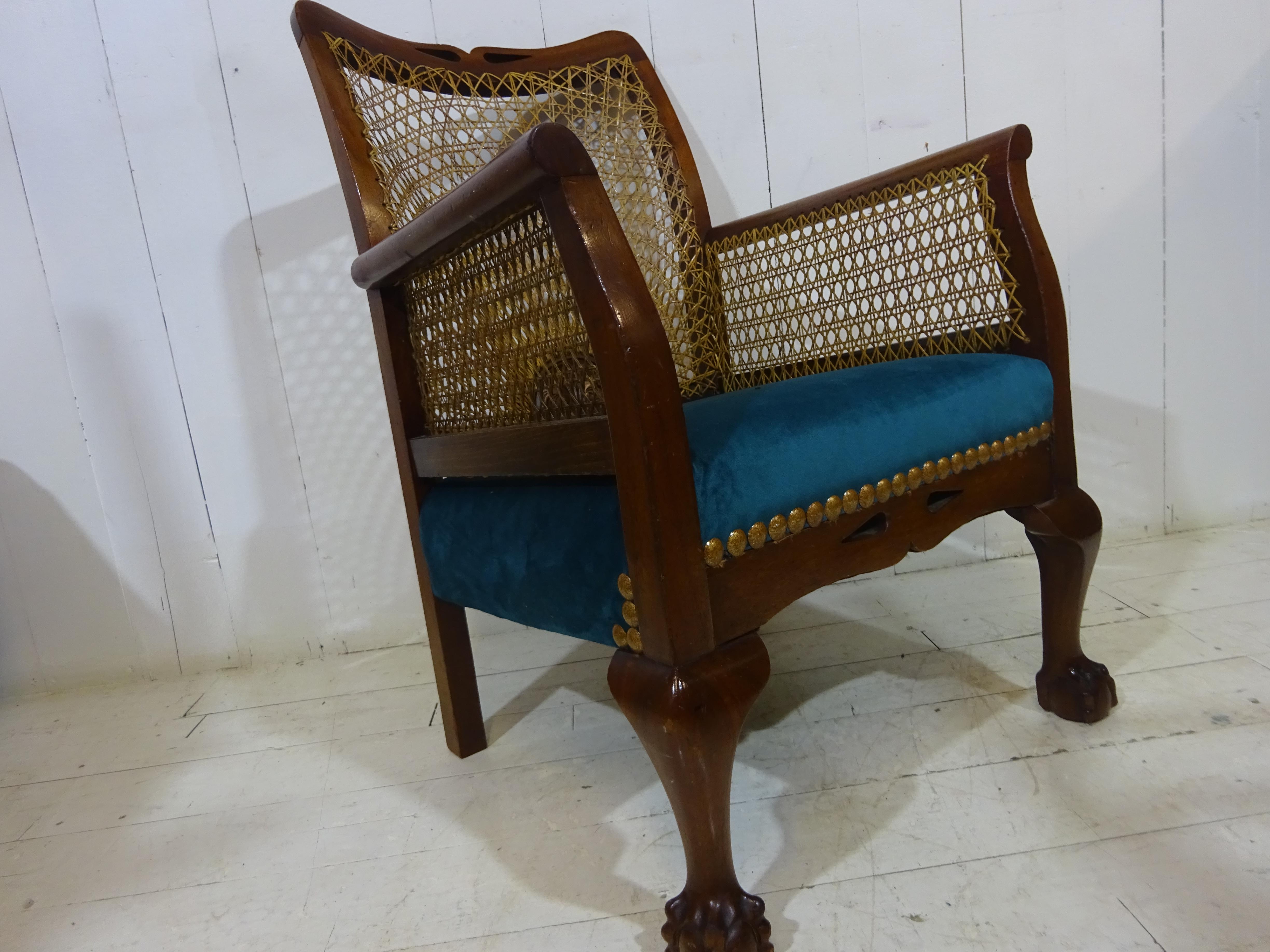 Victorian Hall Chair

A lovely elegant example of this Victorian Hall Chair. 

Frame is solid mahogany, hand crafted with dowel fixings. Hand carved, shaped arms, carved back rest and claw and ball feet. Sides and back rest are finished in woven