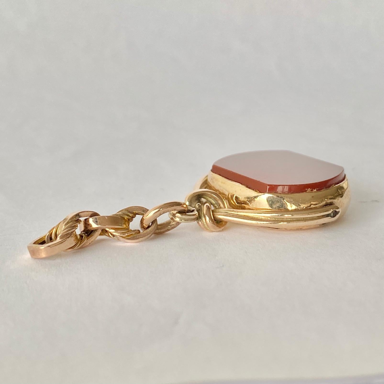 This classic 9ct gold fob holds a carnelian stone which is backed with glossy gold! The frame is modelled as if it is twisted and knotted rope.

Stone Dimensions: 21x16mm 

Weight: 9.2g



