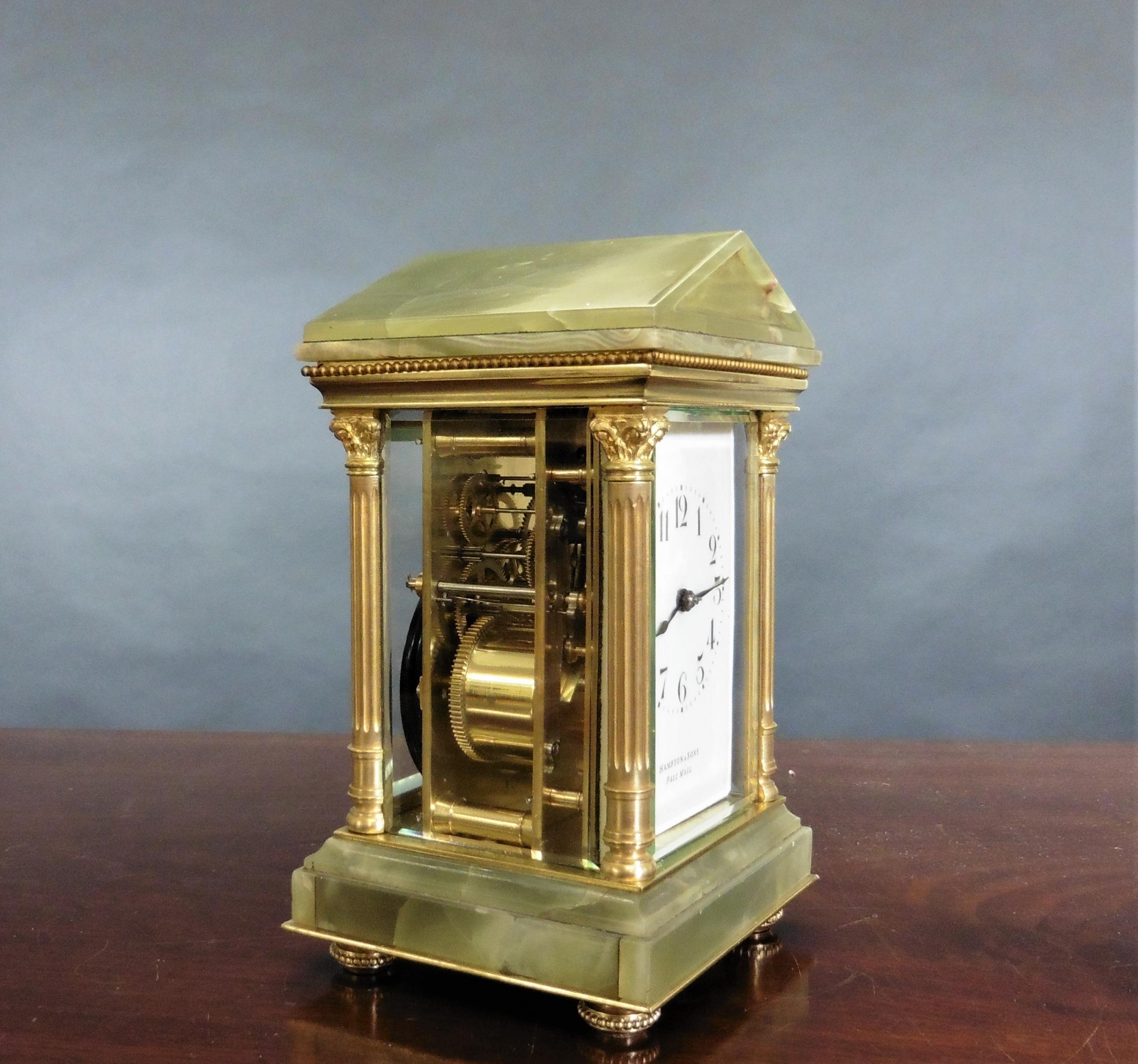 Victorian striking carriage clock, Hampton & Sons, Pall Mall



Victorian carriage clock in a fine variegated green onyx case standing on a raised, stepped base and resting on gilded feet with reeded pillars and Corinthian capitals supporting a
