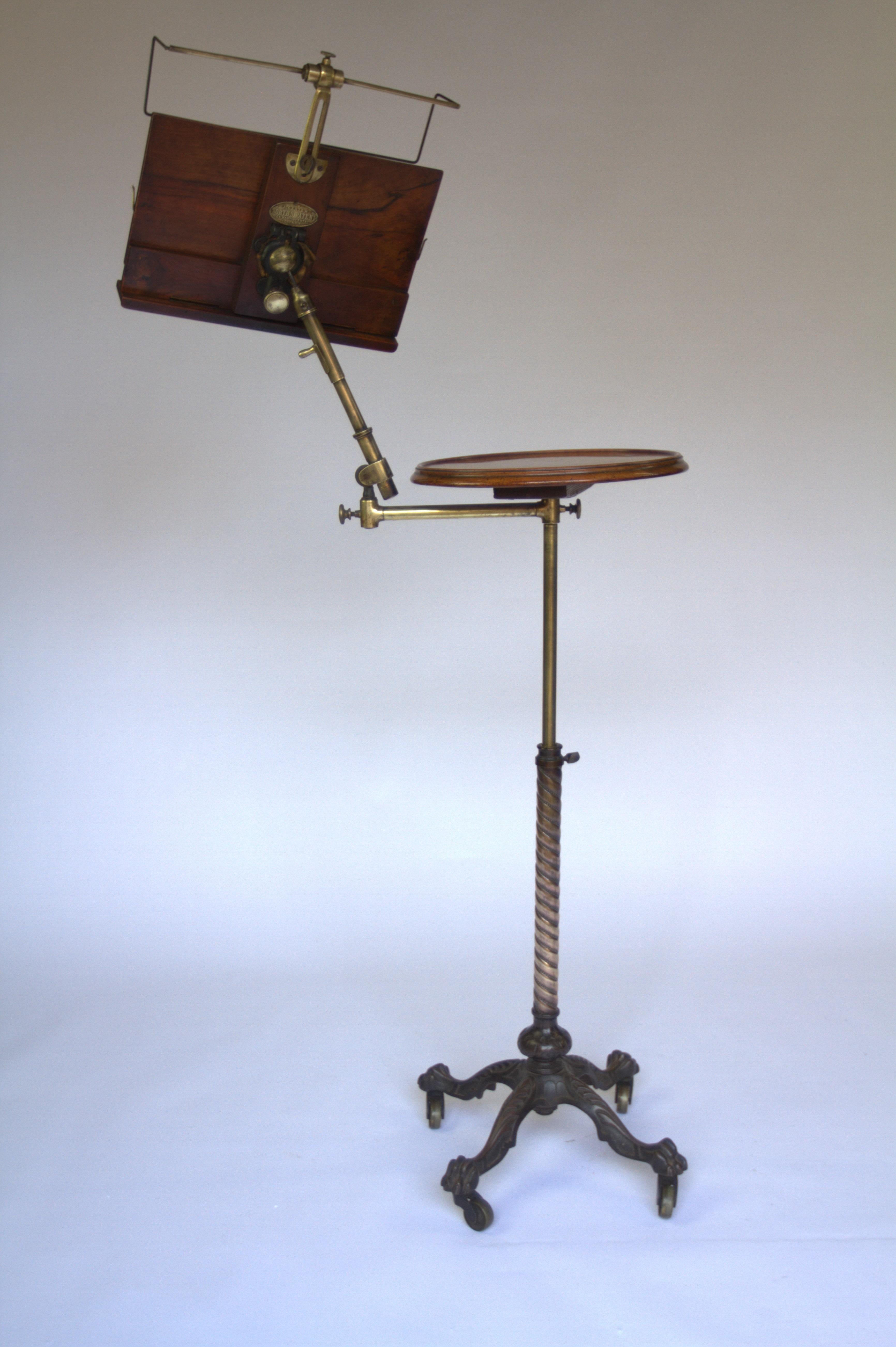 Victorian Carters  Patent Telescopic Reading Stand
Walnut Lectern & Circular top.
Lectern with hinged book rest & brass support at top, 
With J Carter Norths Patent Badge
Adjustable Brass Patent arm 
Brass Telescopic stand with pinch screw
Spiral