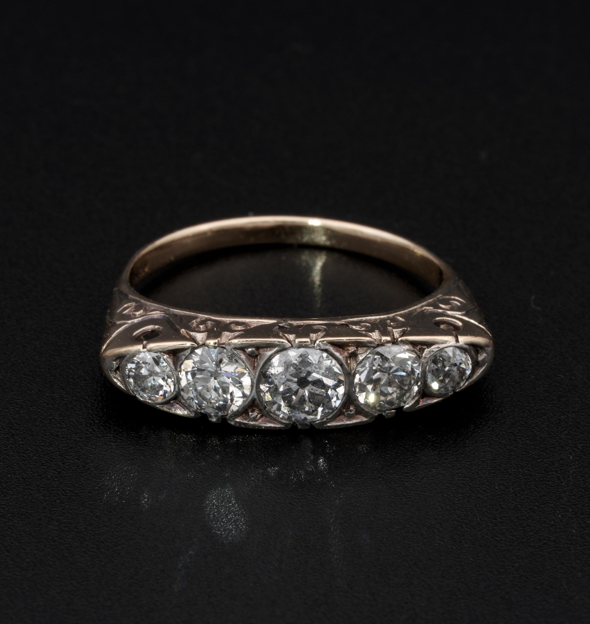 This Gorgeous late Victorian five stone ring is 1900 ca.
Enchanting boat shape skilfully carved and pierced with scroll work  made of solid 18 KT gold – marked
Facing up with a graduated array of Old European cut Diamonds , bigger is .50 going down