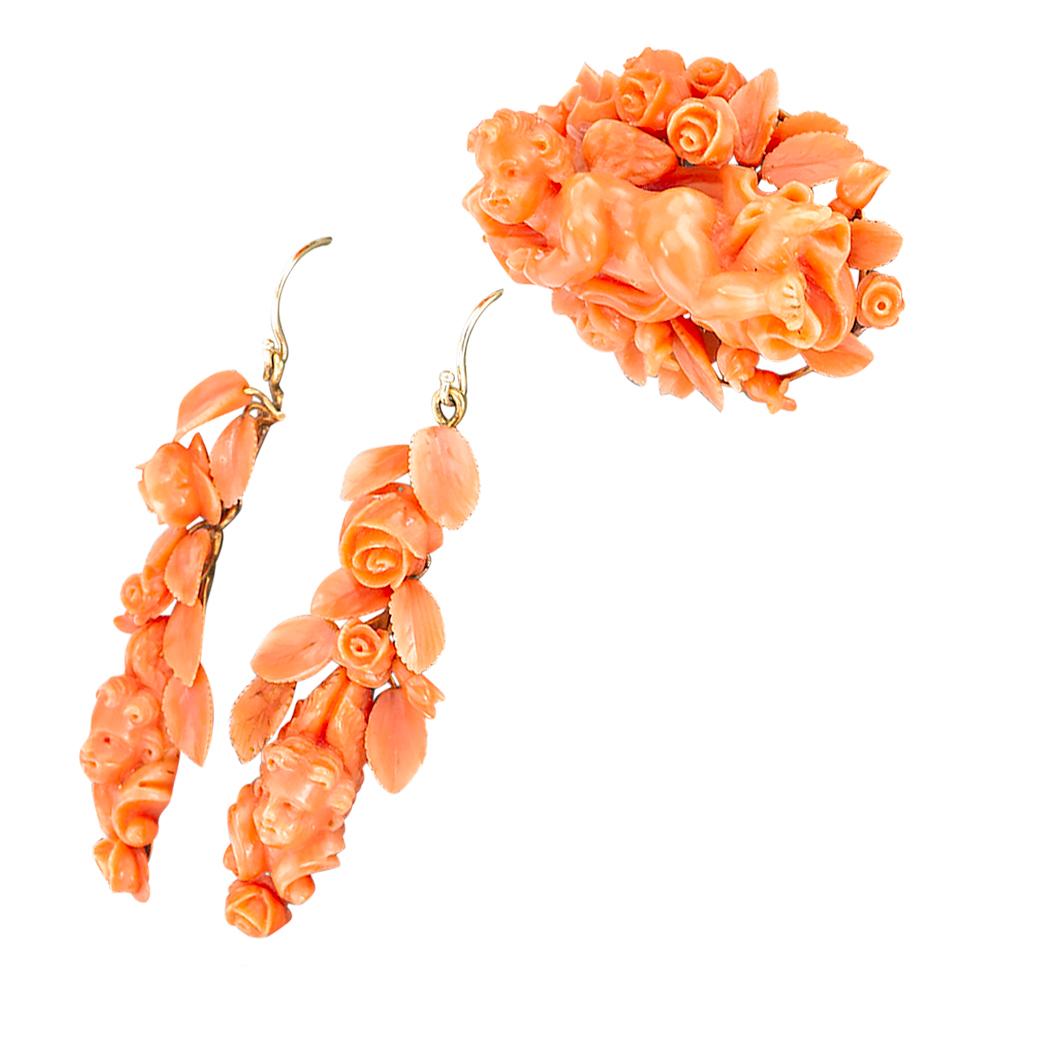 Victorian Carved Coral Brooch and Drop Earring Set Circa 1850. *
ABOUT THIS ITEM:  # P4903.  Scroll down for detailed specifications.  A set of antique jewels comprising a brooch and a pair of matching drop earrings.  The intricate designs are