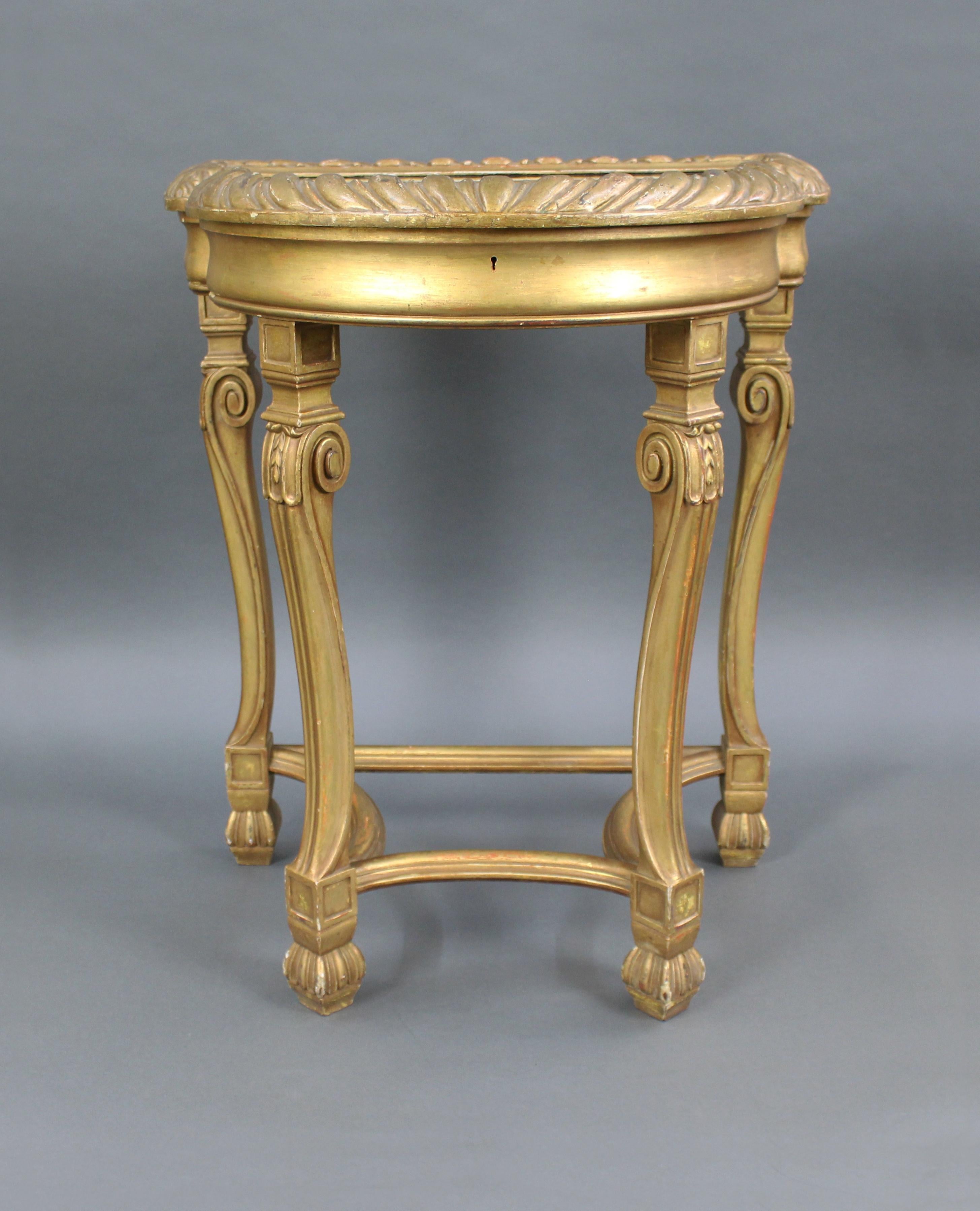 Measures: Width 61 cm 24 in
Depth 46 cm 18 in
Height 72.5 cm 28 1/2 in.
 

 

Period: 19th century
Wood: Carved wood
Finish: Gilt
Condition: Good condition. Sound structure. A little wear to gilt finish as pictured
 

 

Offered for