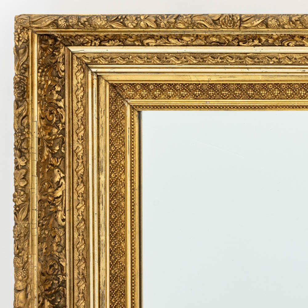 Victorian Carved Giltwood Mirror, late 19th century, with floral and geometric frame. Mirror: 28.5