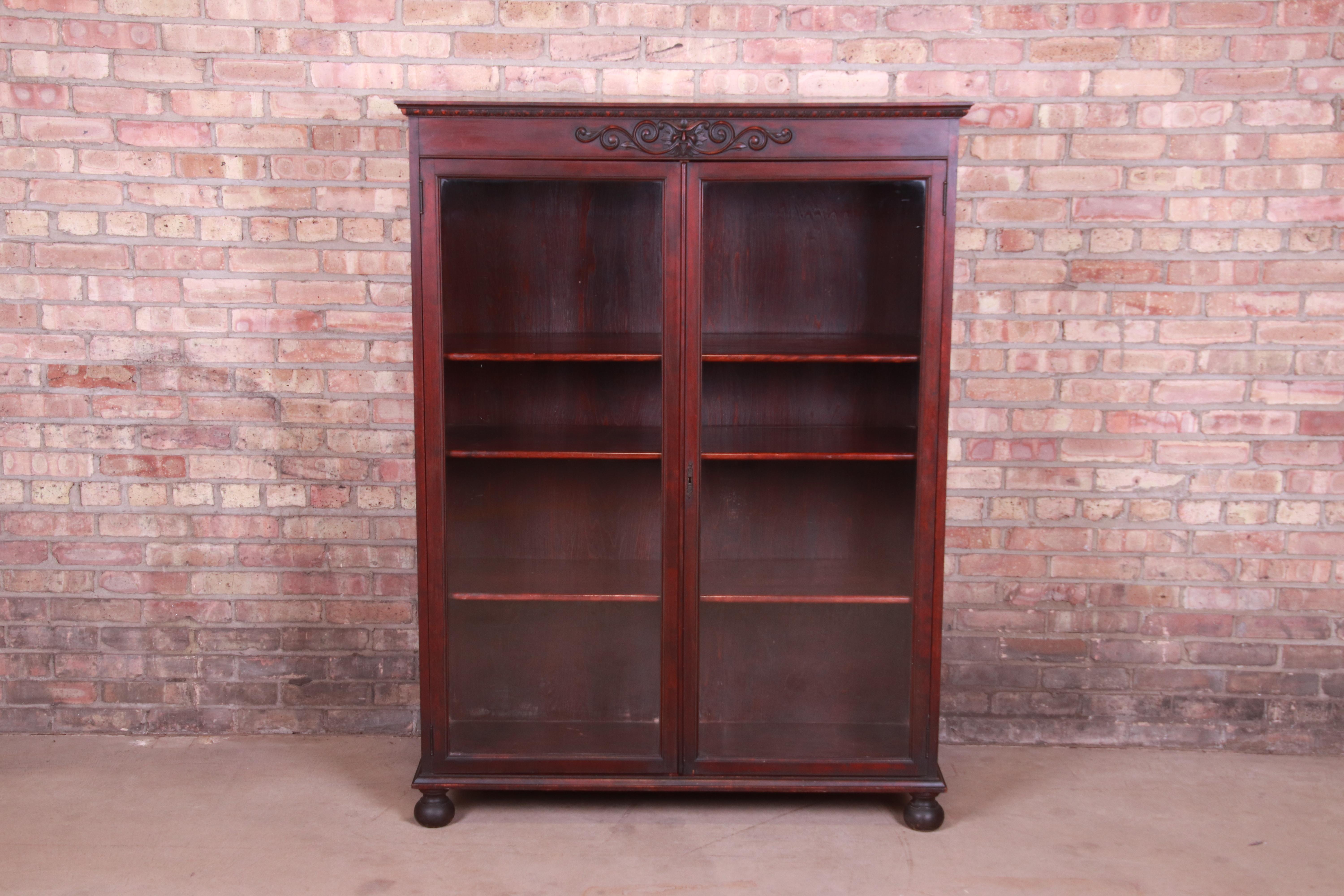 American Victorian Carved Mahogany Bookcase with Old Man of the North Carving, Circa 1890