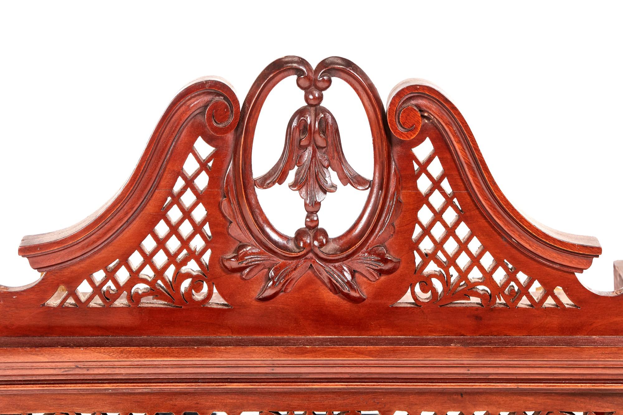 Quality Victorian antique carved mahogany overmantle wall mirror with an outstandingly carved swan-neck pediment, six elegantly shaped bevelled edge mirrors and attractive turned mahogany columns supporting a shaped shelf.

A very attractive piece