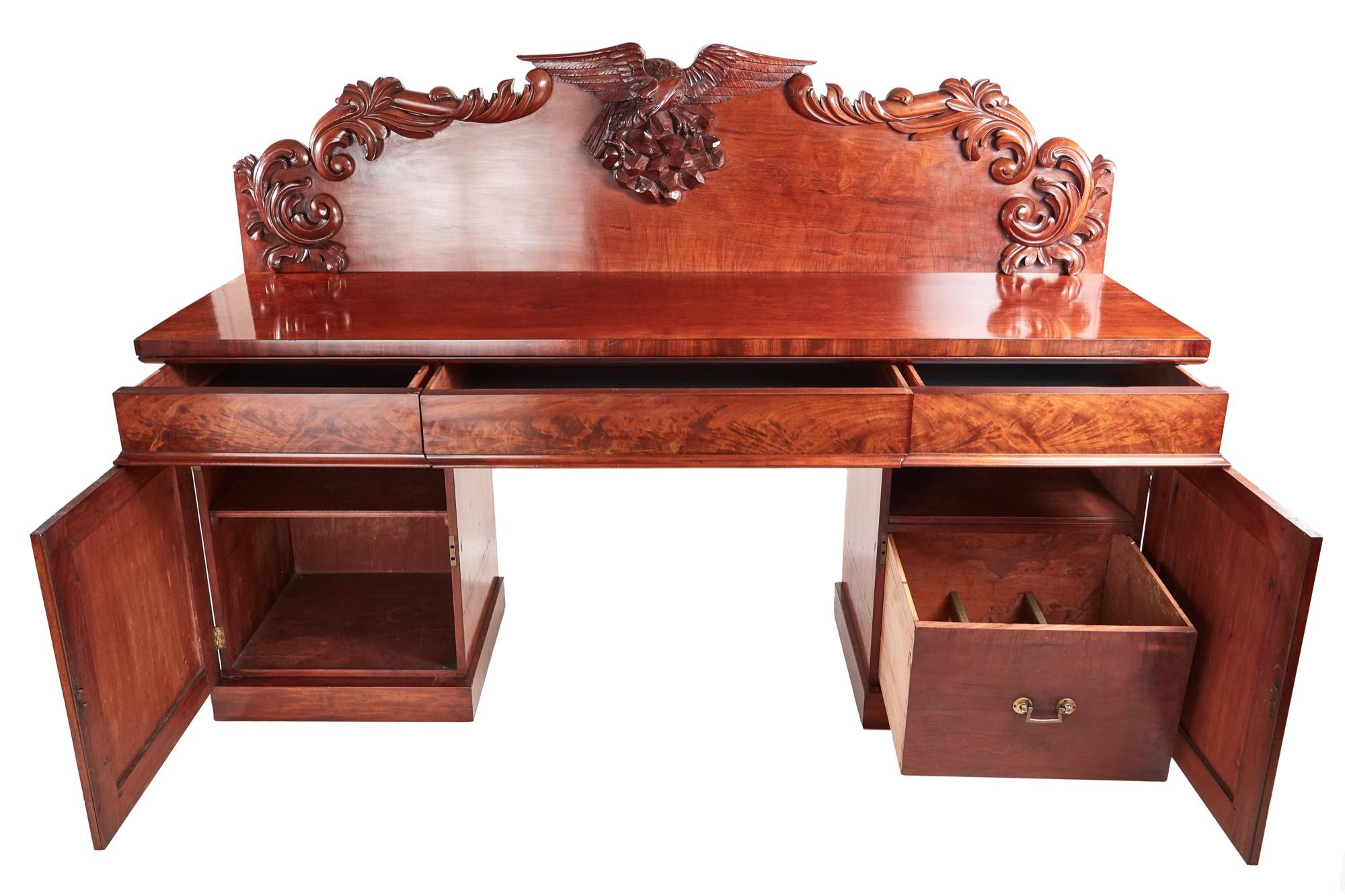 Quality 19th century Victorian antique carved mahogany sideboard. It has a lovely mahogany top with three frieze drawers and is supported by two pedestals with quality carved doors. It has a fitted interior. It stands on a plinth base. All