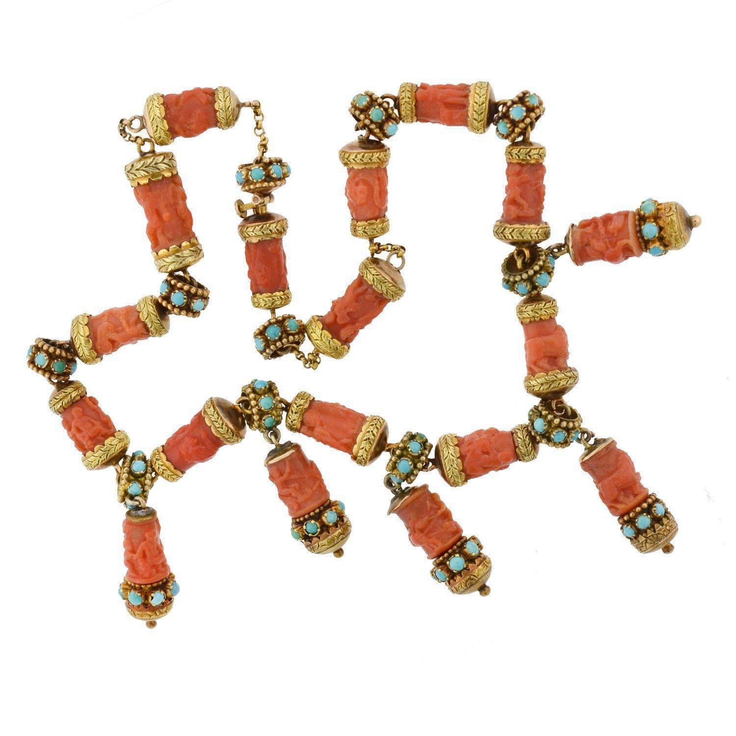 A rare and stunning coral and turquoise necklace from the Victorian (ca1880) era! This 14kt yellow gold piece features gorgeous hand-carved coral links that form a chain, with 5 links dangling from the center in a festoon-style fashion. The