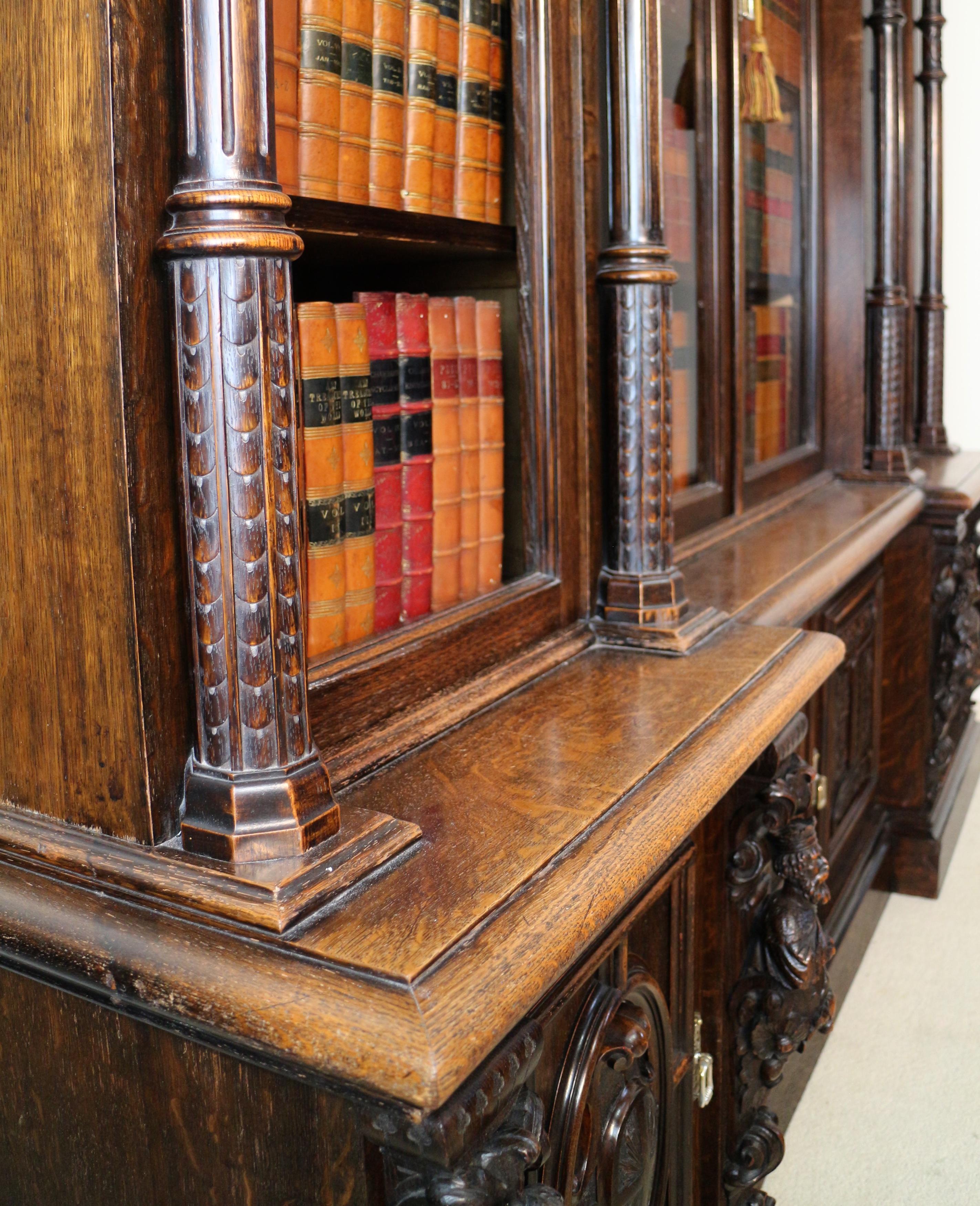 Glass Victorian Carved Oak Elizabethan Revival Breakfront Bookcase by Wylie & Lochhead