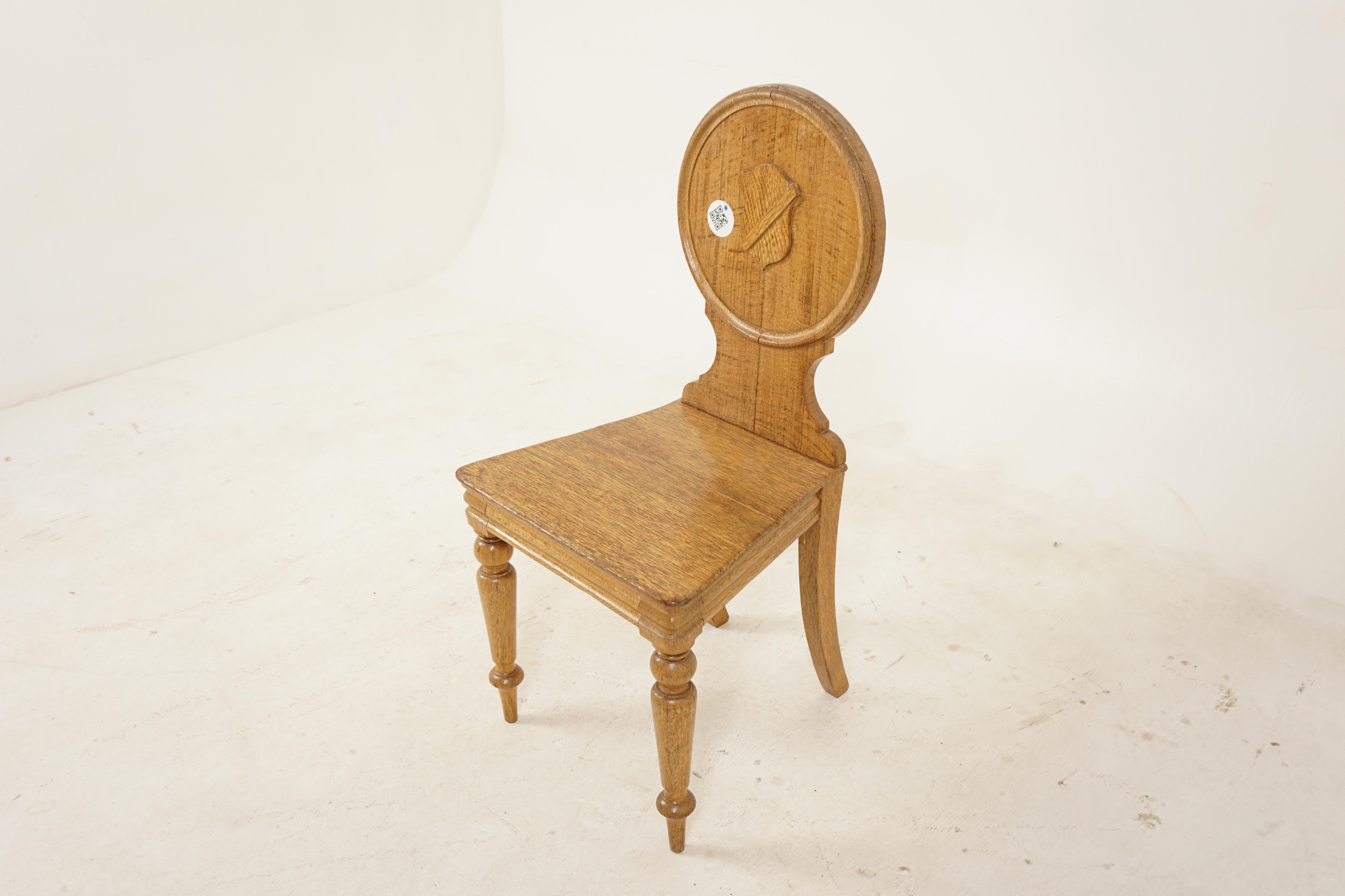 Victorian carved oak shield back hall chair, Scotland, 1880
Scotland 1880
Solid Oak
Original Finish
Circular shaped backrest
Sold flat base seat
Standing on turn front legs and out swept back legs
Strong in joint with no wobbles
Some marks