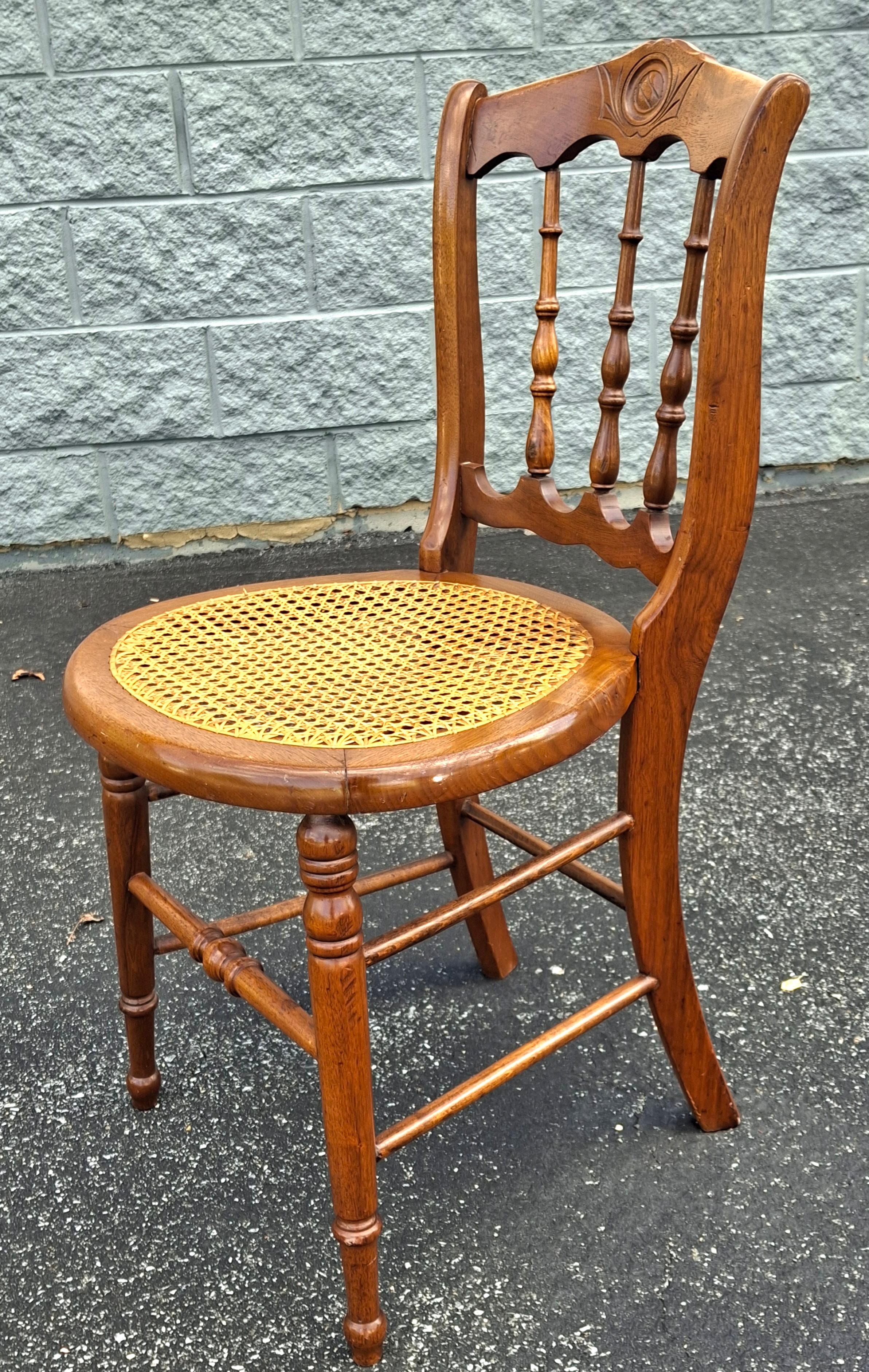 American Victorian Carved Walnut and Cane Seat Side Chair For Sale