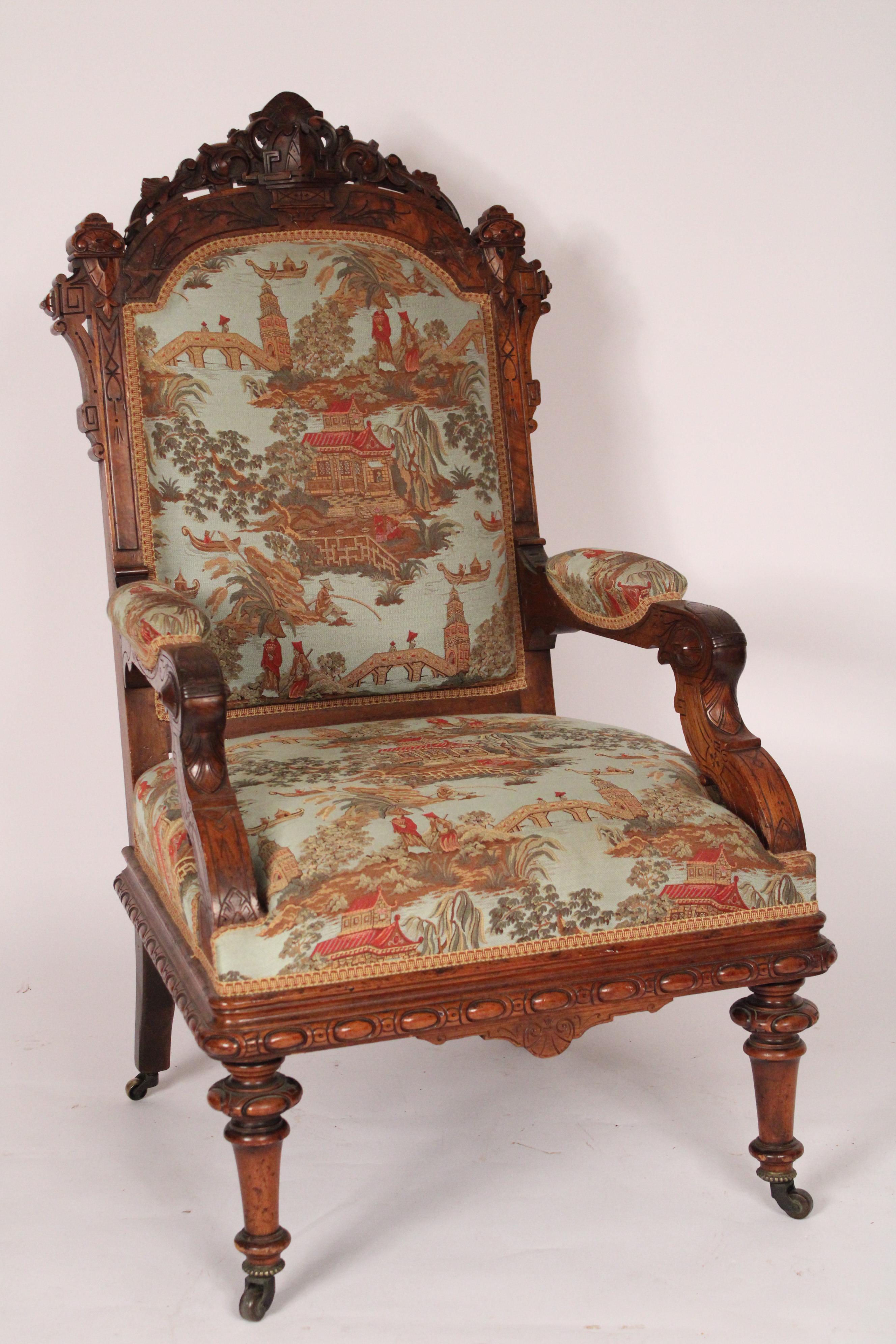 Antique Victorian carved walnut and burl walnut armchair, circa 1880. Recently re upholstered in a chinoiserie design fabric. The seat height is 18