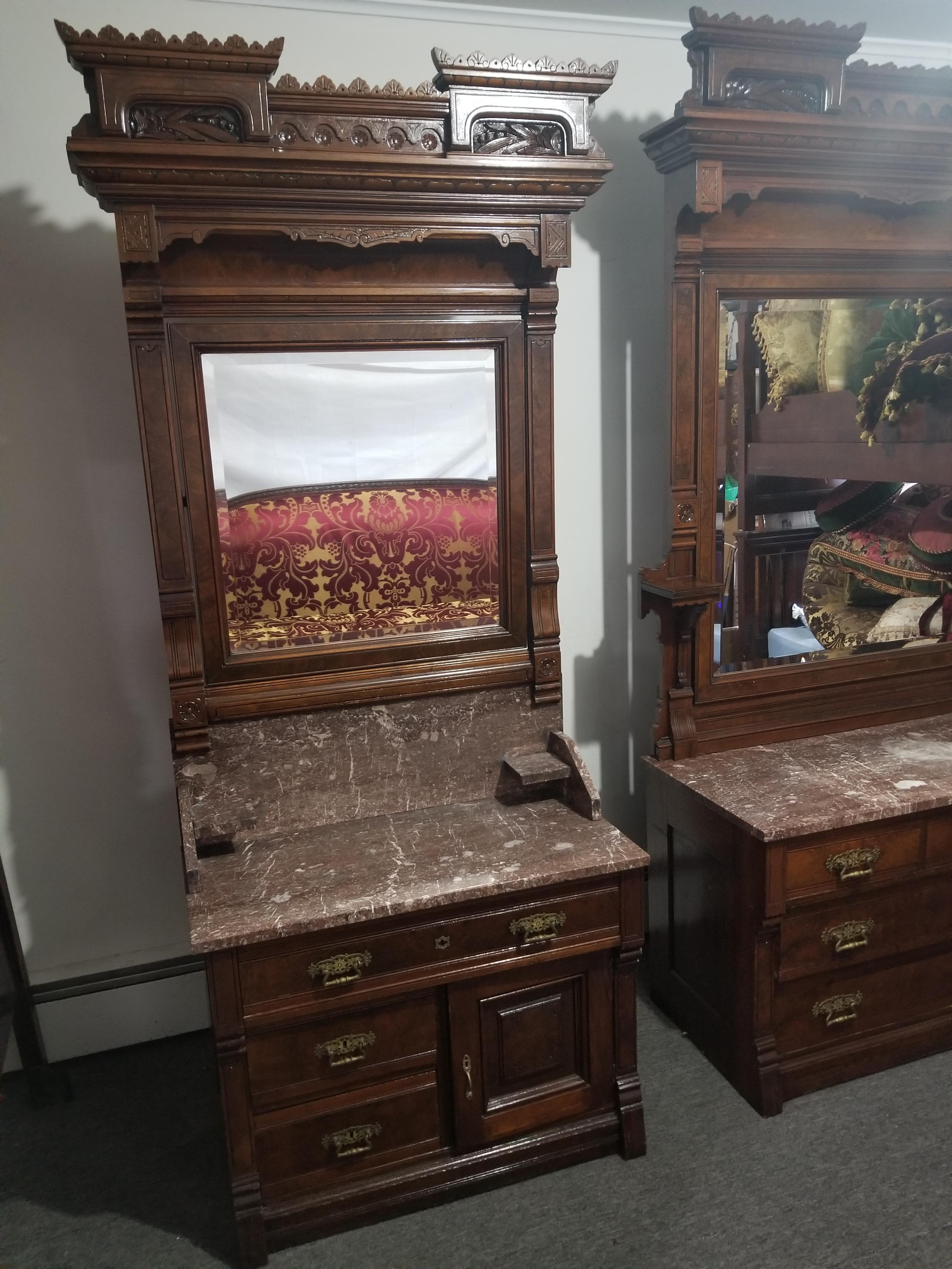 Bedroom suite fine antique American three-piece Victorian carved walnut bedroom suite, Renaissance revival., Circa 18 70. Each of excellent quality, richly embellished with carved peppermint and Gallery, wheat and berry motifs, stepped and paneled.
