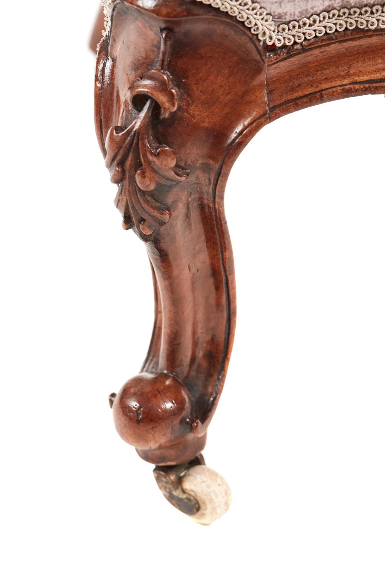 This is a fine Victorian antique carved walnut ladies chair with lovely carved detail to the top. It has a shaped back and serpentine carved front rail. It stands on lovely carved cabriole legs with out swept back legs. 

All in solid walnut