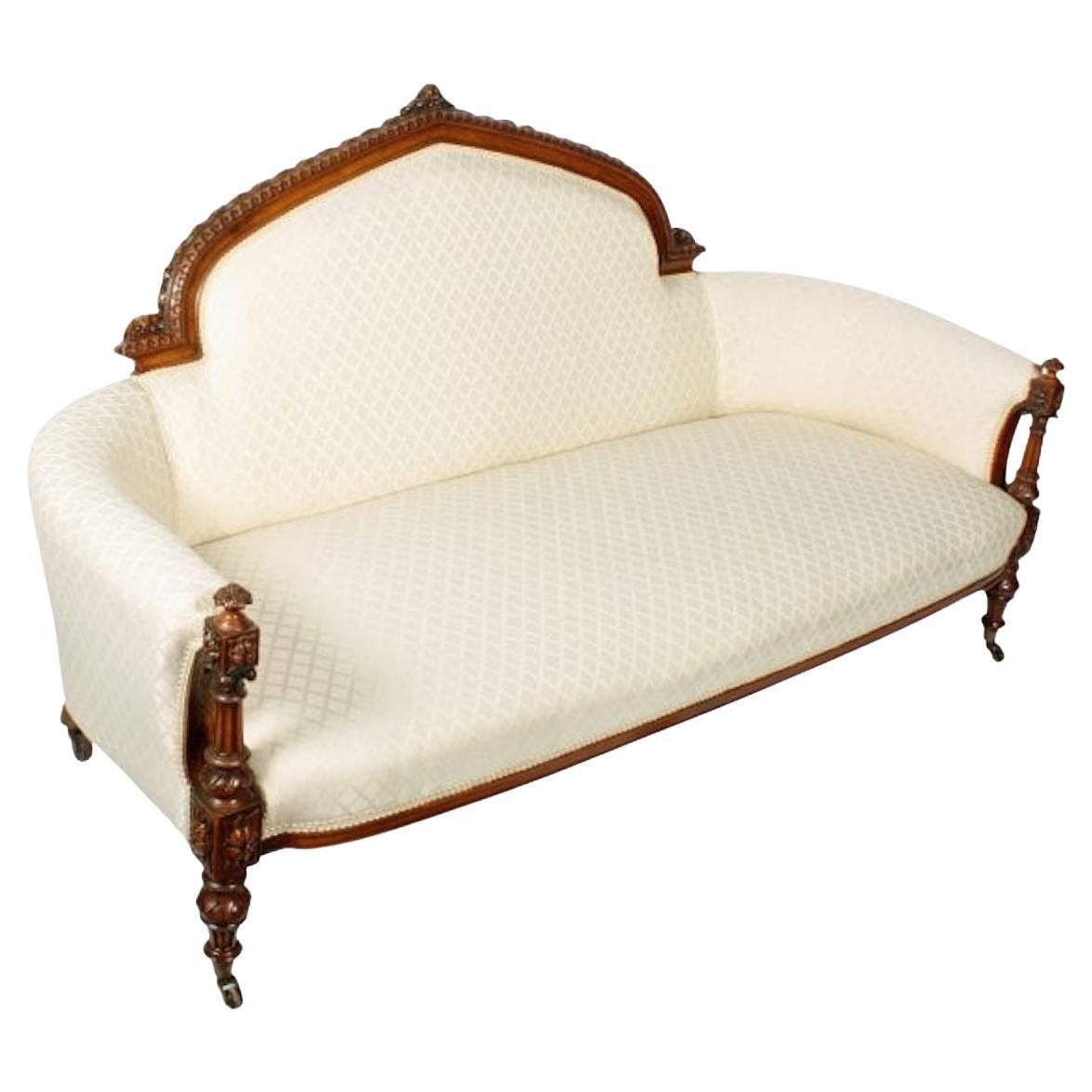Victorian carved walnut settee

A mid-19th century Victorian carved walnut settee.

The settee has a domed back with a highly decorative carved walnut frame and is upholstered in a cream coloured contemporary material.

The front legs are