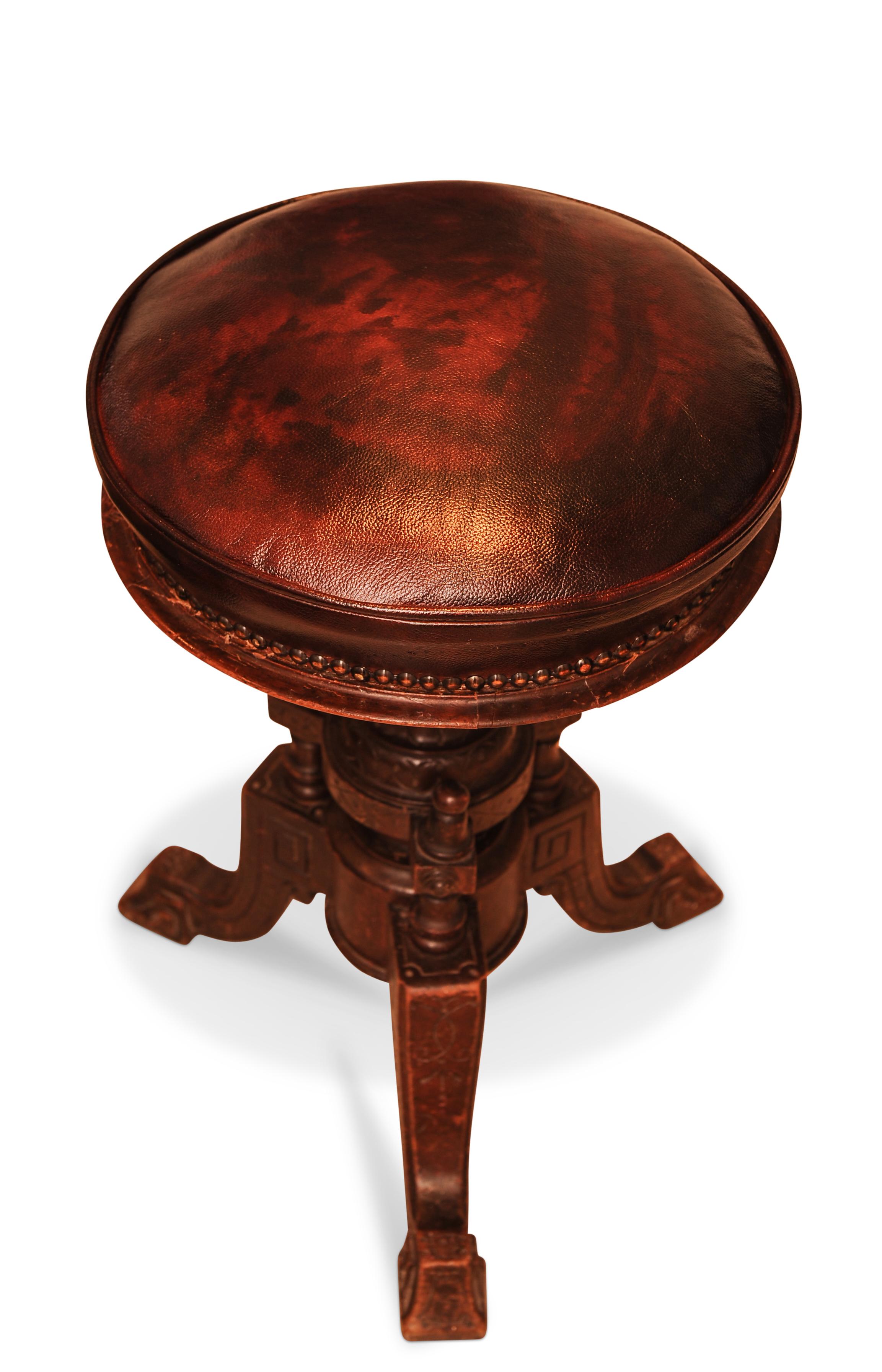 Elegant Classical Victorian Carved Wood Revolving Piano Stool With Brown Leather Seat Finished With Brass Studs Circa 1850's

Height to seat: 48cm - 57cm