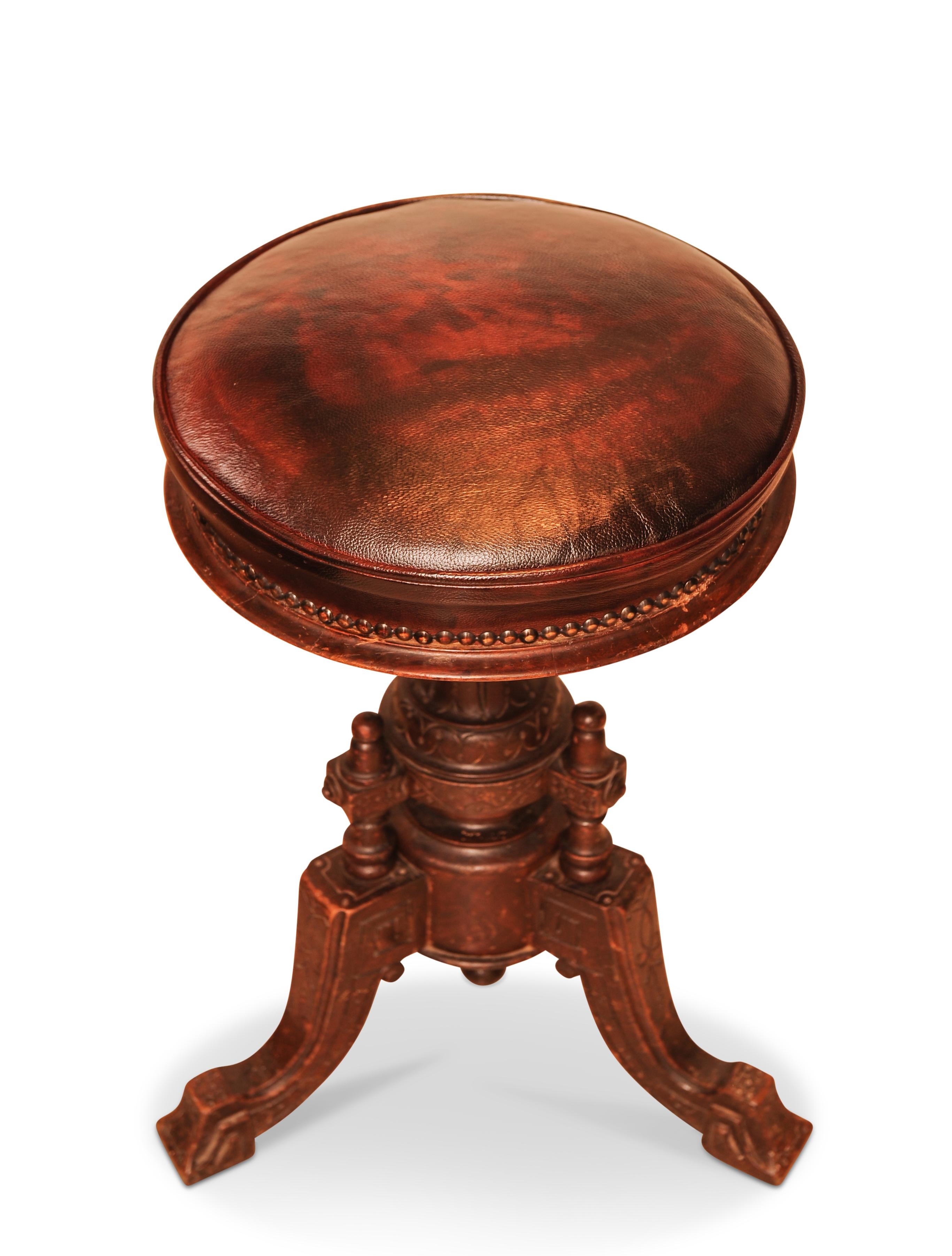 British Victorian Carved Wood Revolving Piano Stool With Brown Leather Seat Brass Studs For Sale