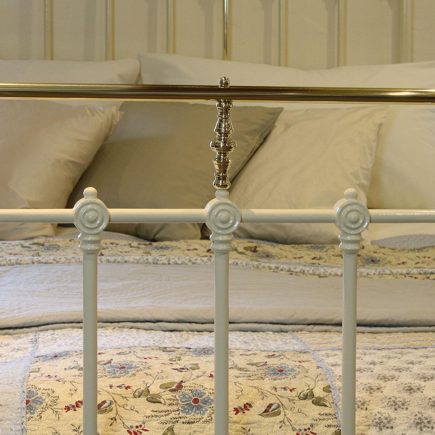 cream iron bed