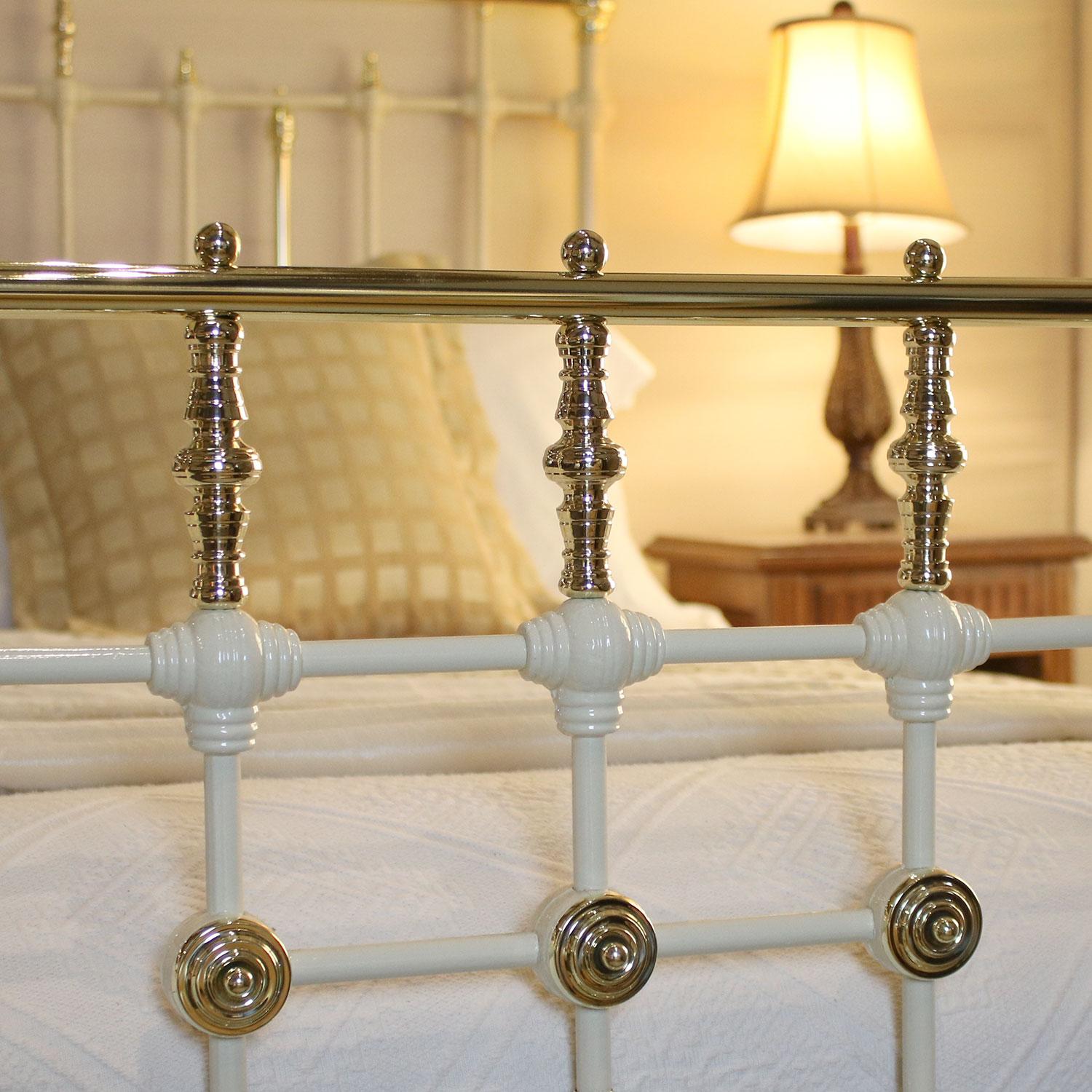 cream wrought iron bed